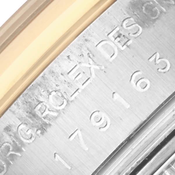 The image shows a close-up of the side engraving on a Rolex Datejust 179163 Women's Steel and Gold (two tone) Mother of Pearl Dial 179163 Women's Steel and Gold (two tone) Mother of Pearl Dial watch case.