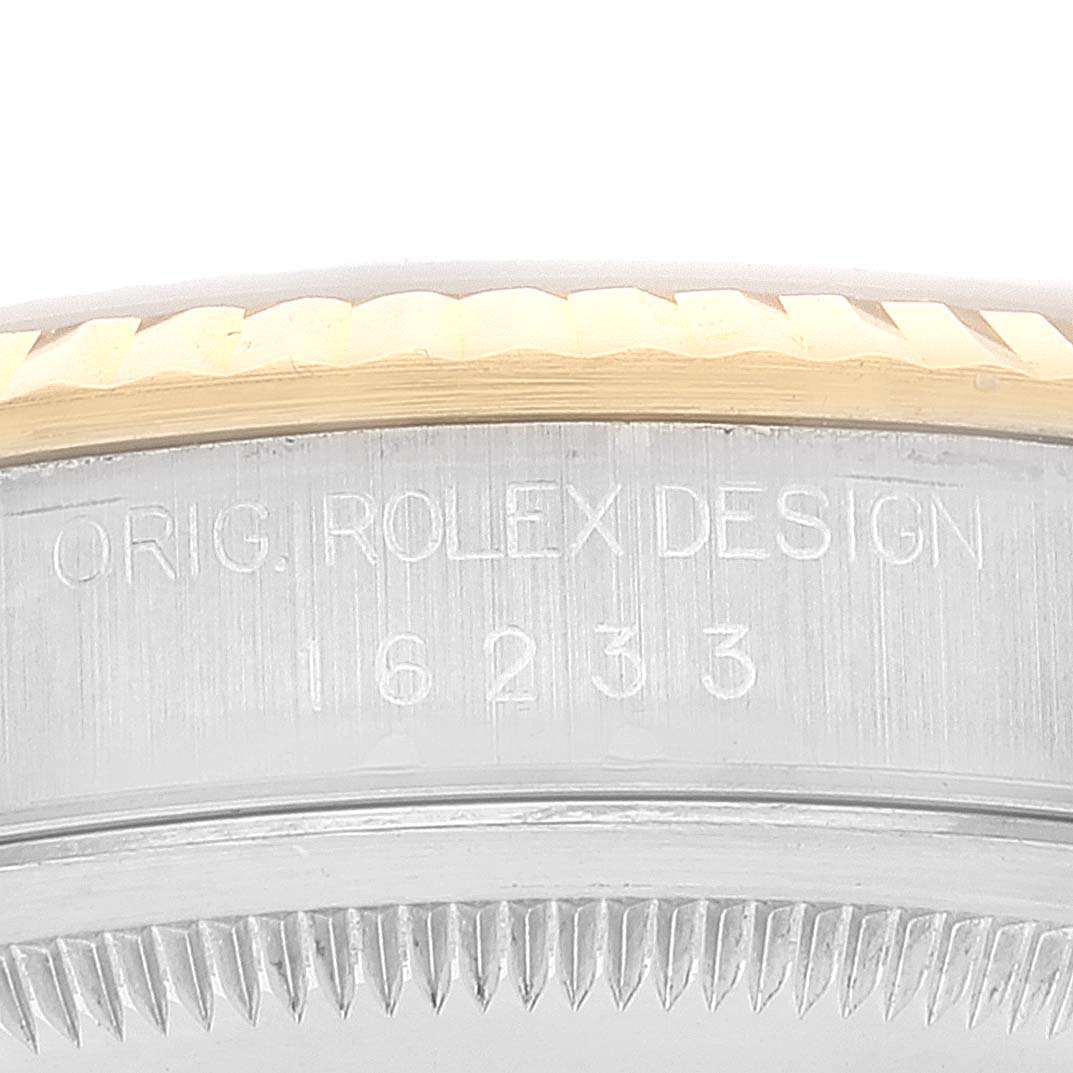 The image shows a close-up of the model and design engraving on the casing of a Rolex Datejust 16233 Men's Steel and Gold (two tone) Silver Dial 16233 Men's Steel and Gold (two tone) Silver Dial watch.