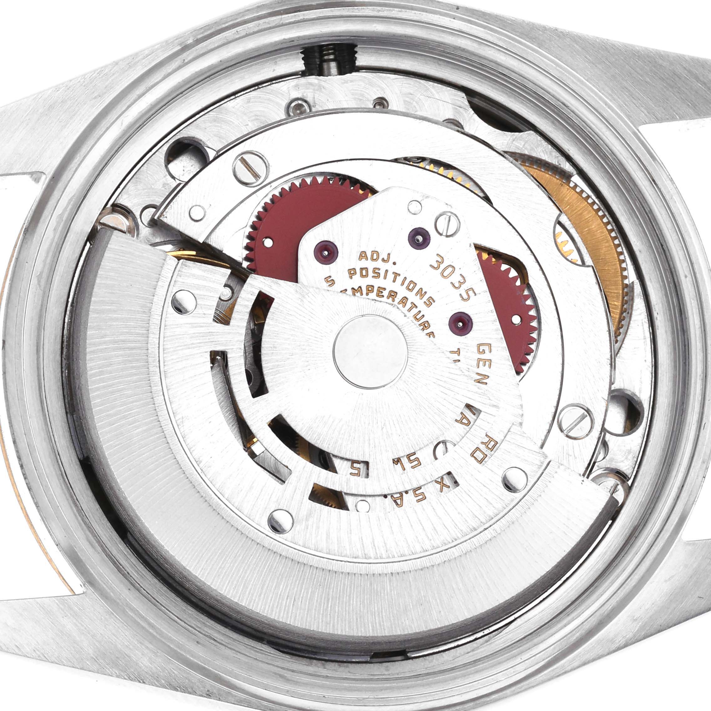 The image shows the movement of a Rolex Datejust 16013 Men's Steel and Gold (two tone) Champagne Dial 16013 Men's Steel and Gold (two tone) Champagne Dial watch from a close-up, top-down angle, highlighting its mechanical components.