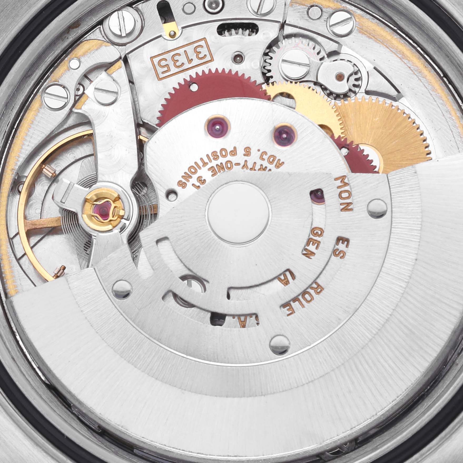 The image shows the intricate movement mechanism of a Rolex Datejust 16233 Men's Steel and Gold (two tone) White Dial 16233 Men's Steel and Gold (two tone) White Dial watch, highlighting gears and components from a top-down angle.