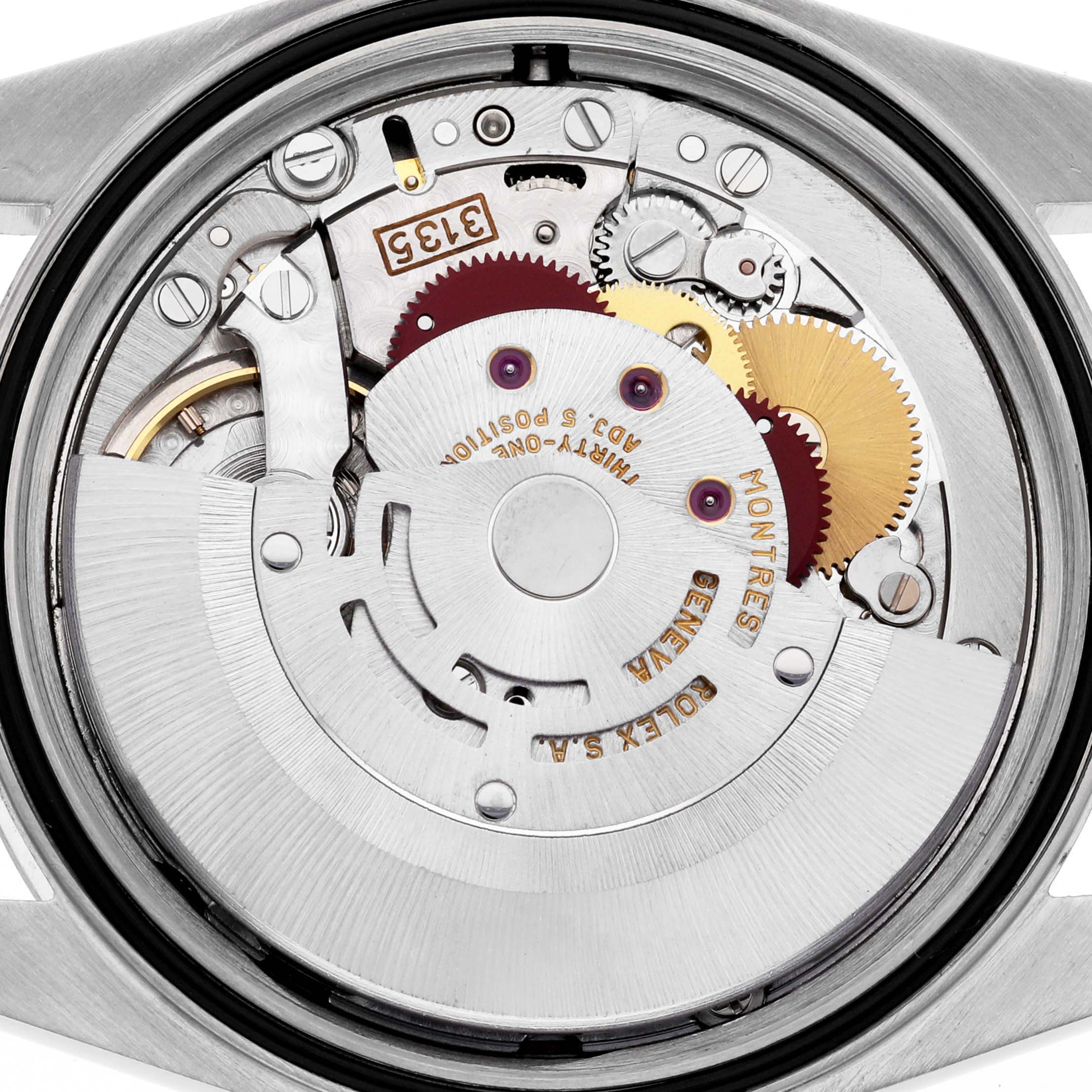 The image shows the Rolex Datejust 16233 Men's Steel and Gold (two tone) White Dial 16233 Men's Steel and Gold (two tone) White Dial's movement from a top-down angle, revealing its intricate mechanical components.