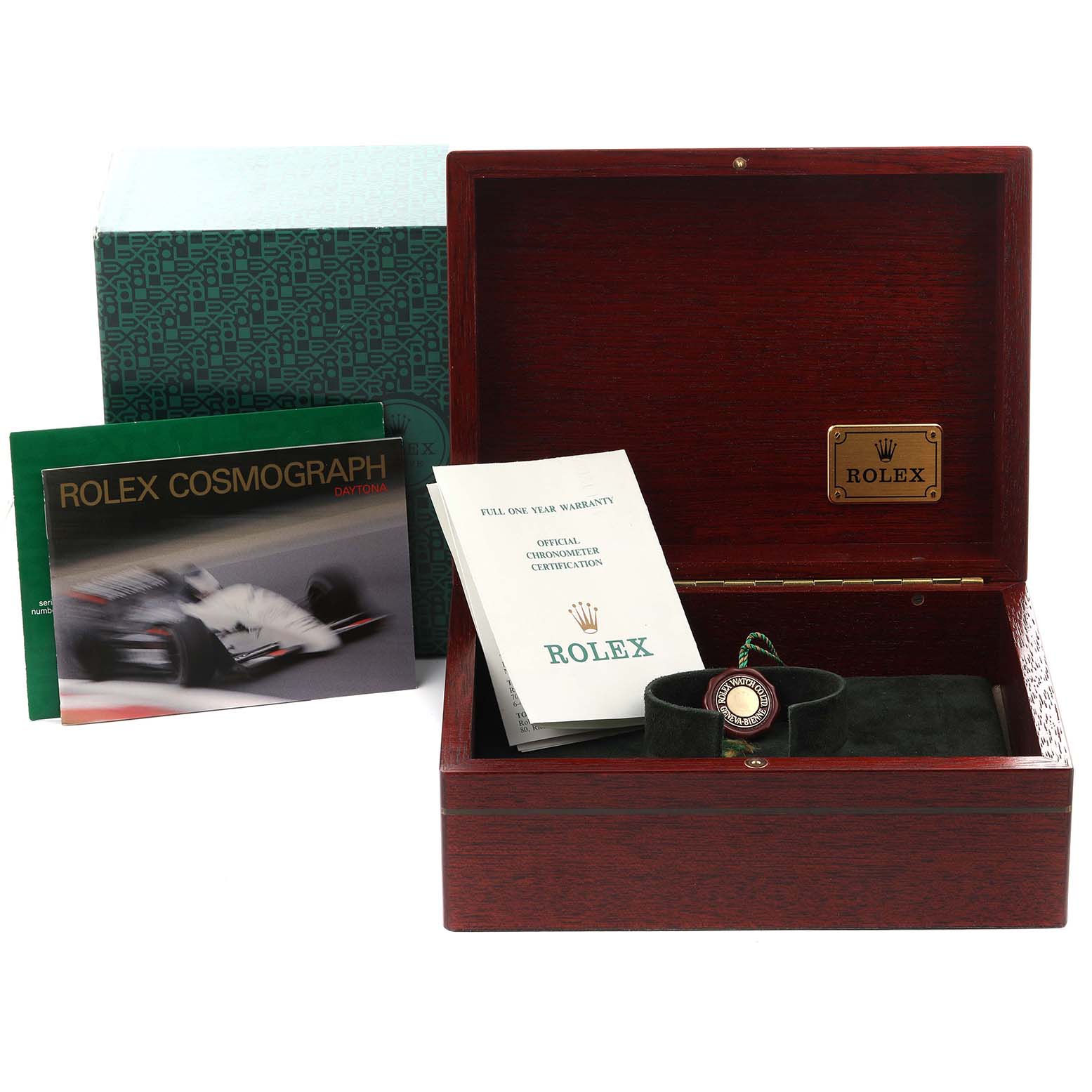 The image shows a Rolex Daytona 16528 Men's Yellow Gold Black Dial 16528 Men's Yellow Gold Black Dial box, manuals, and a warranty card at an angle, but not the watch itself.