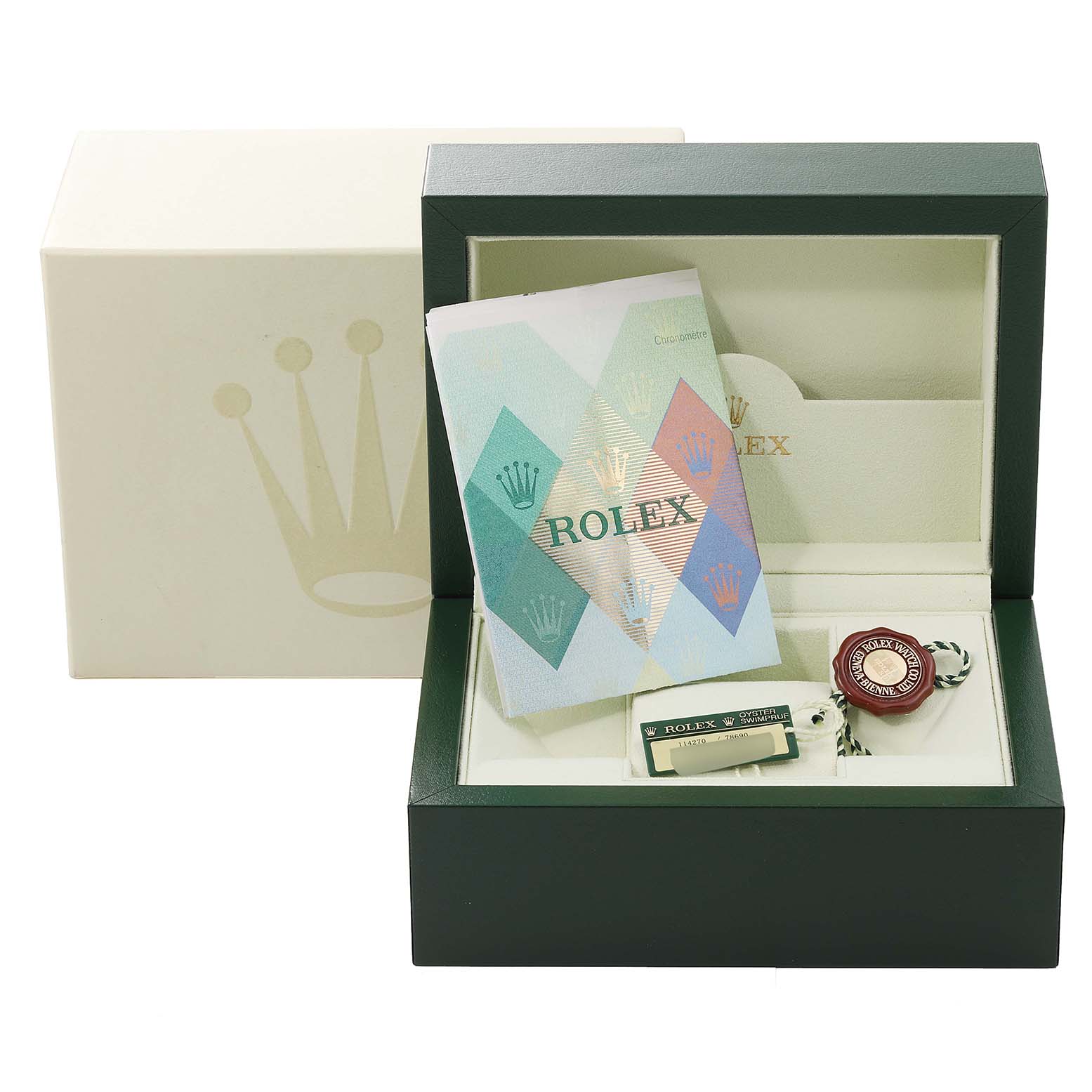 The image shows the opened box of a Rolex Explorer 114270 Men
s Stainless Steel Black Dial 114270 Men
s Stainless Steel Black Dial watch, its manual, tags, and packaging materials.