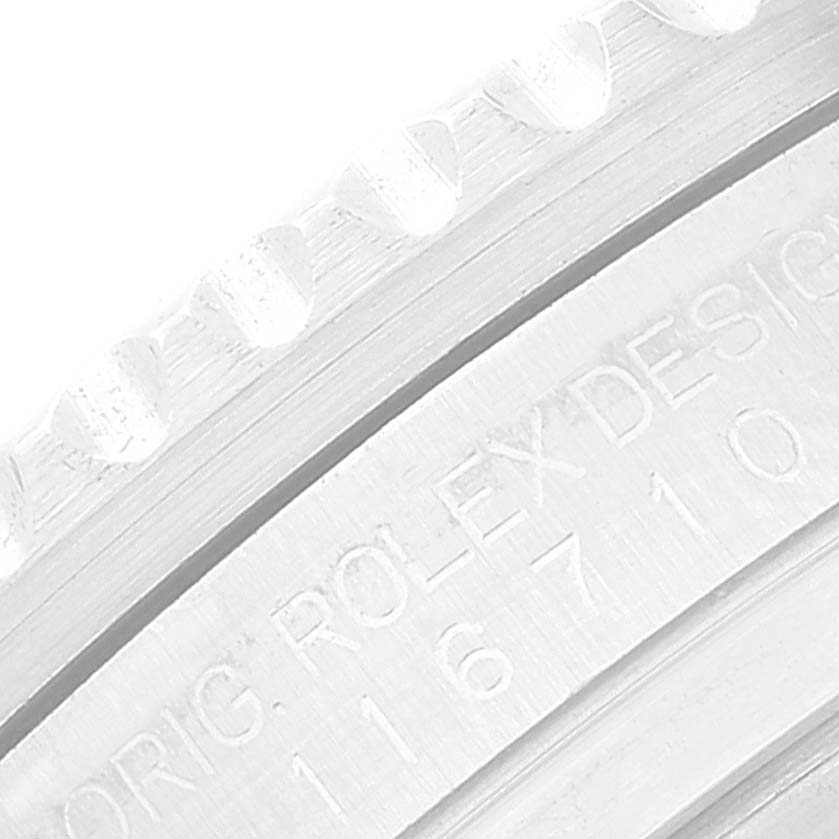 This image shows a close-up of the bezel and engraved design details of a Rolex GMT-Master 116710 Men
s Stainless Steel Black Dial 116710 Men
s Stainless Steel Black Dial watch.