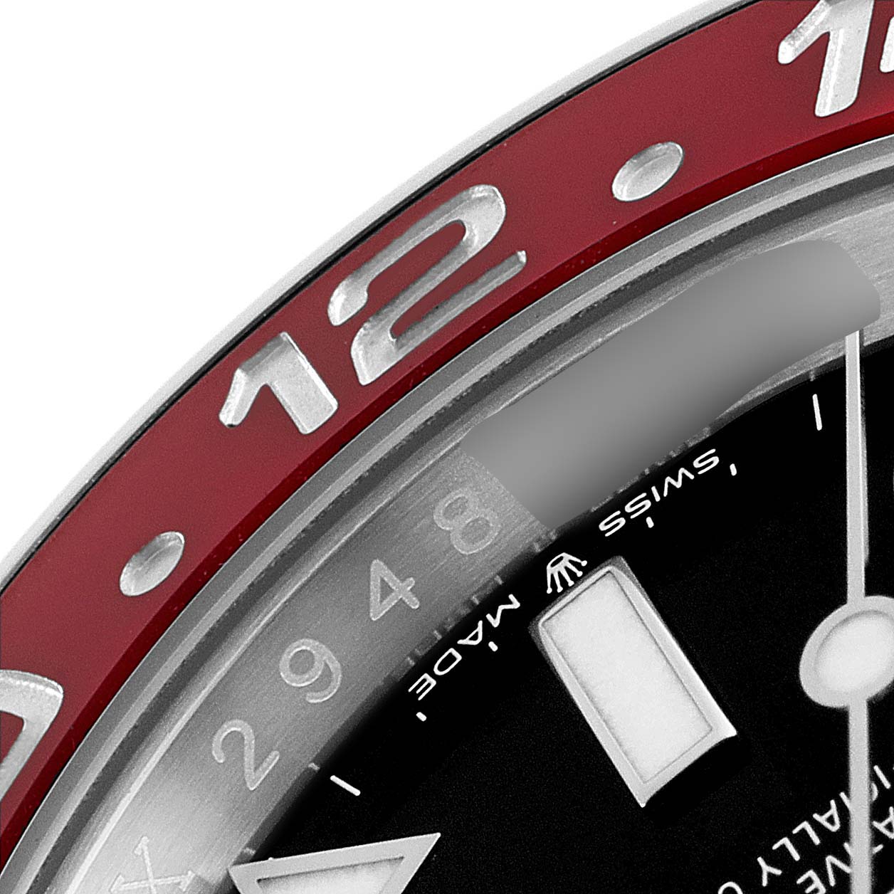 This close-up image of the Rolex GMT-Master 126710 Men
s Stainless Steel Black Dial 126710 Men
s Stainless Steel Black Dial watch shows a partial view of the bezel, dial, and hour marker at an angle.