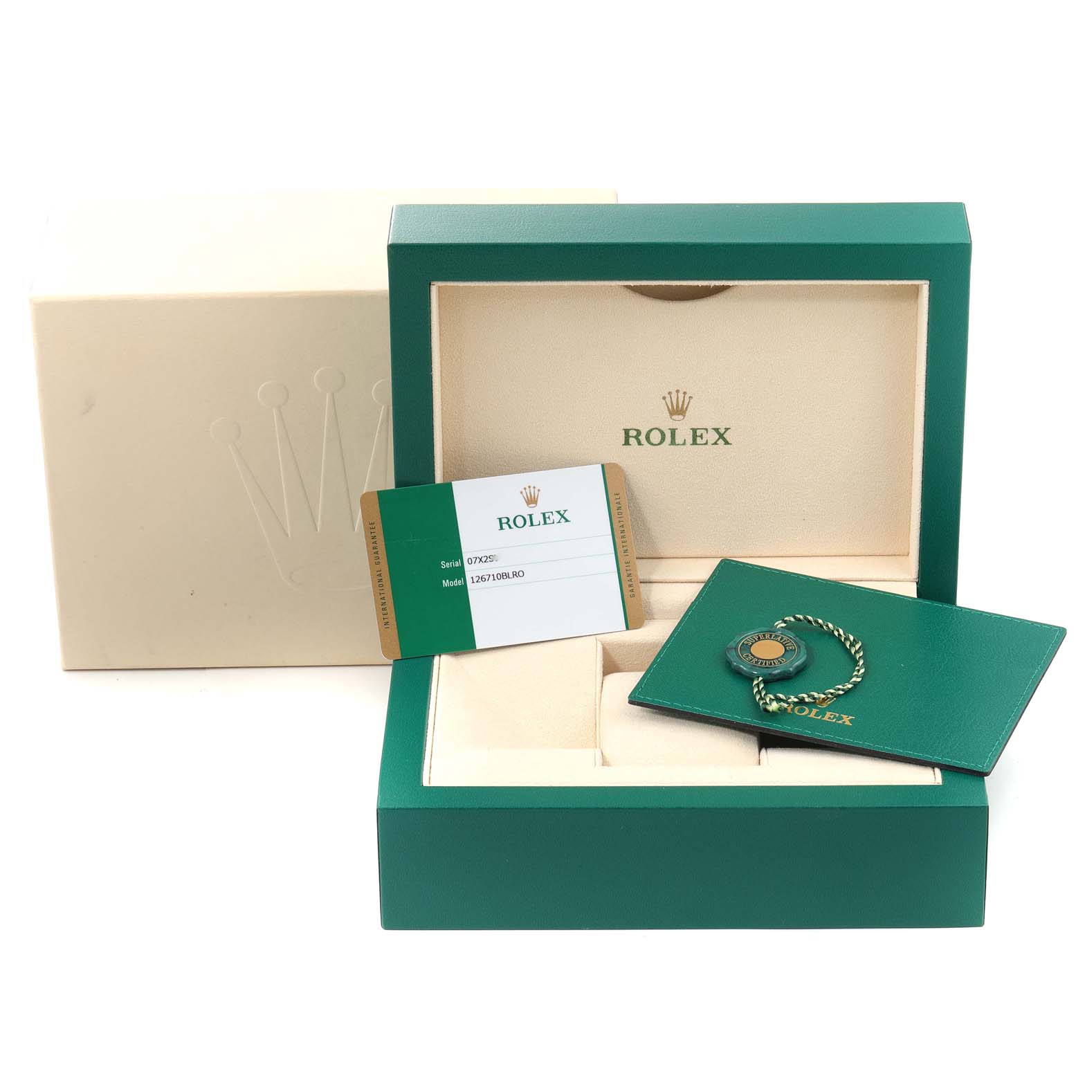 The image shows a green Rolex GMT-Master 126710 Men
s Stainless Steel Black Dial 126710 Men
s Stainless Steel Black Dial watch box, an Best Quality
ity card, and a booklet with a tag, angled from the front.