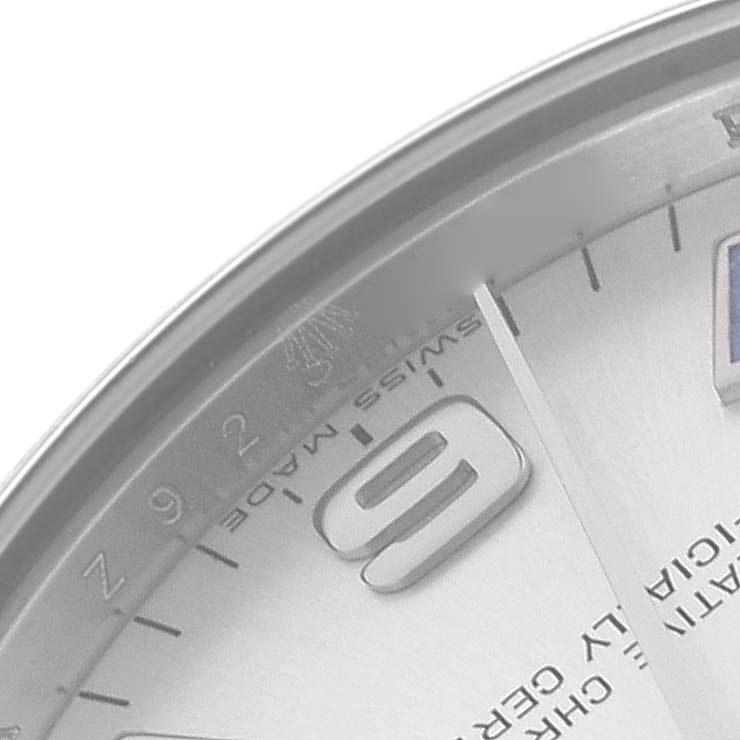 The image shows a close-up of the dial edge, featuring hour markers and text on a Rolex Mid-Size 177200 Women
s Stainless Steel Silver Dial 177200 Women
s Stainless Steel Silver Dial watch.