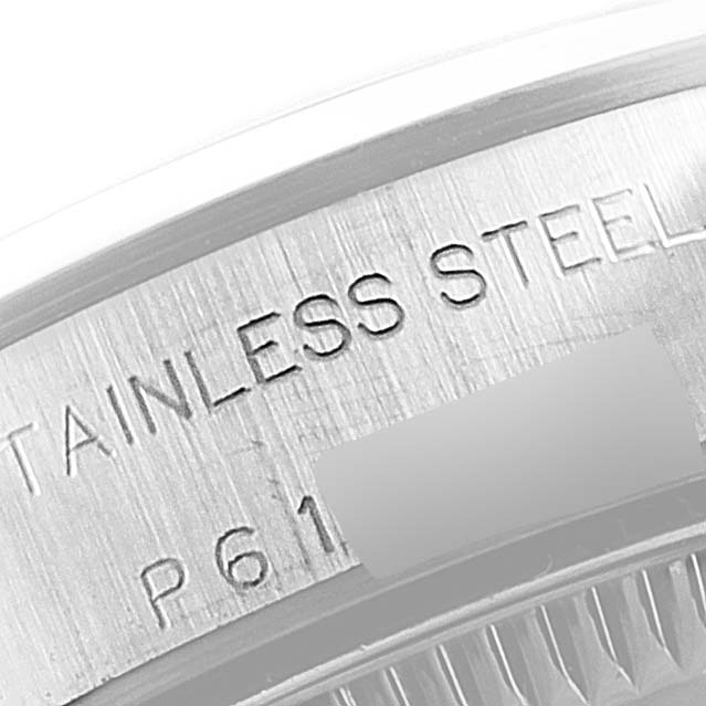 This close-up image shows the stainless steel back casing of a Rolex Oyster Perpetual 76080 Women's Stainless Steel Black Dial 76080 Women's Stainless Steel Black Dial watch.