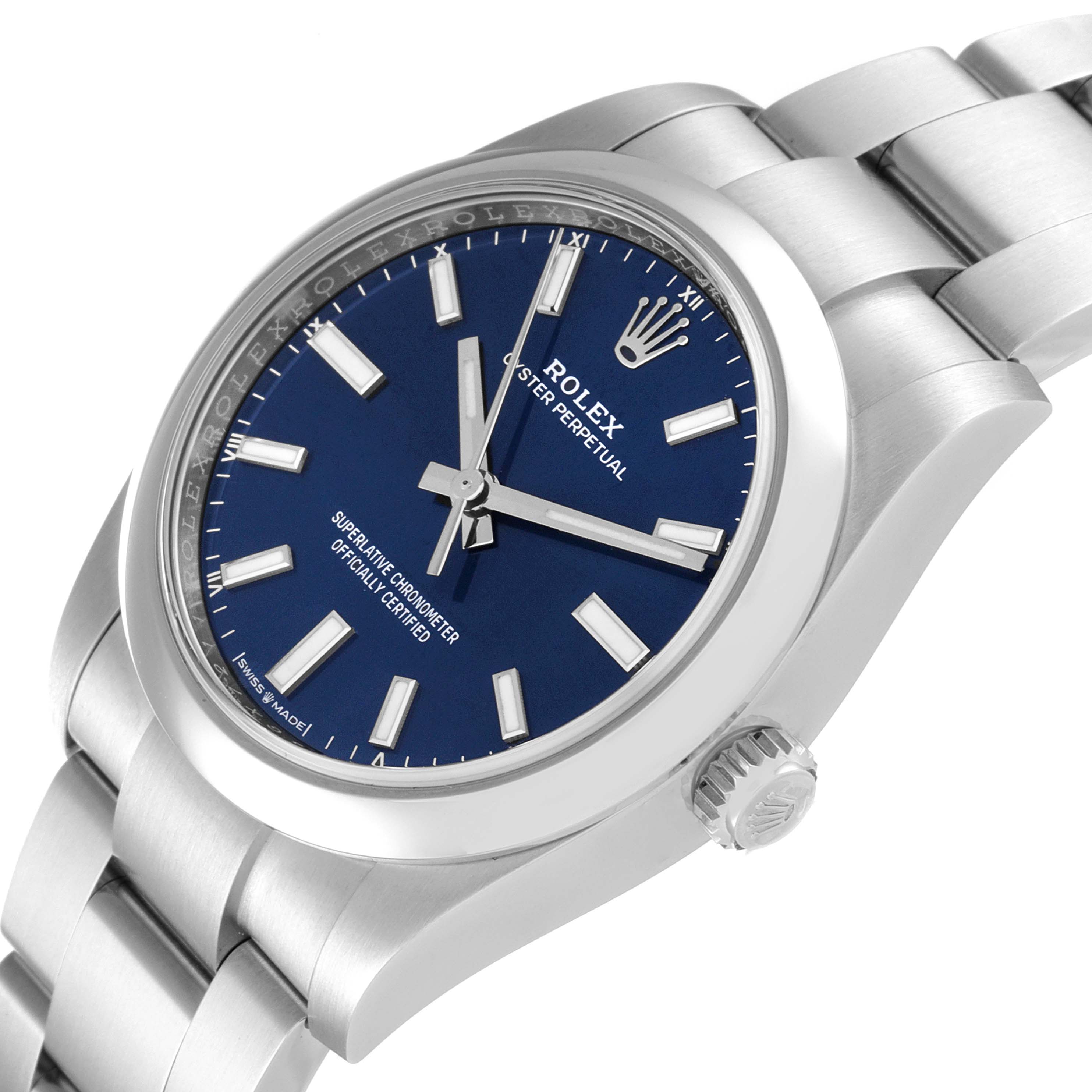 The image shows a Rolex Oyster Perpetual 124200 Men
s Stainless Steel Blue Dial 124200 Men
s Stainless Steel Blue Dial watch from a slight angle, highlighting its face, bezel, and part of the bracelet.