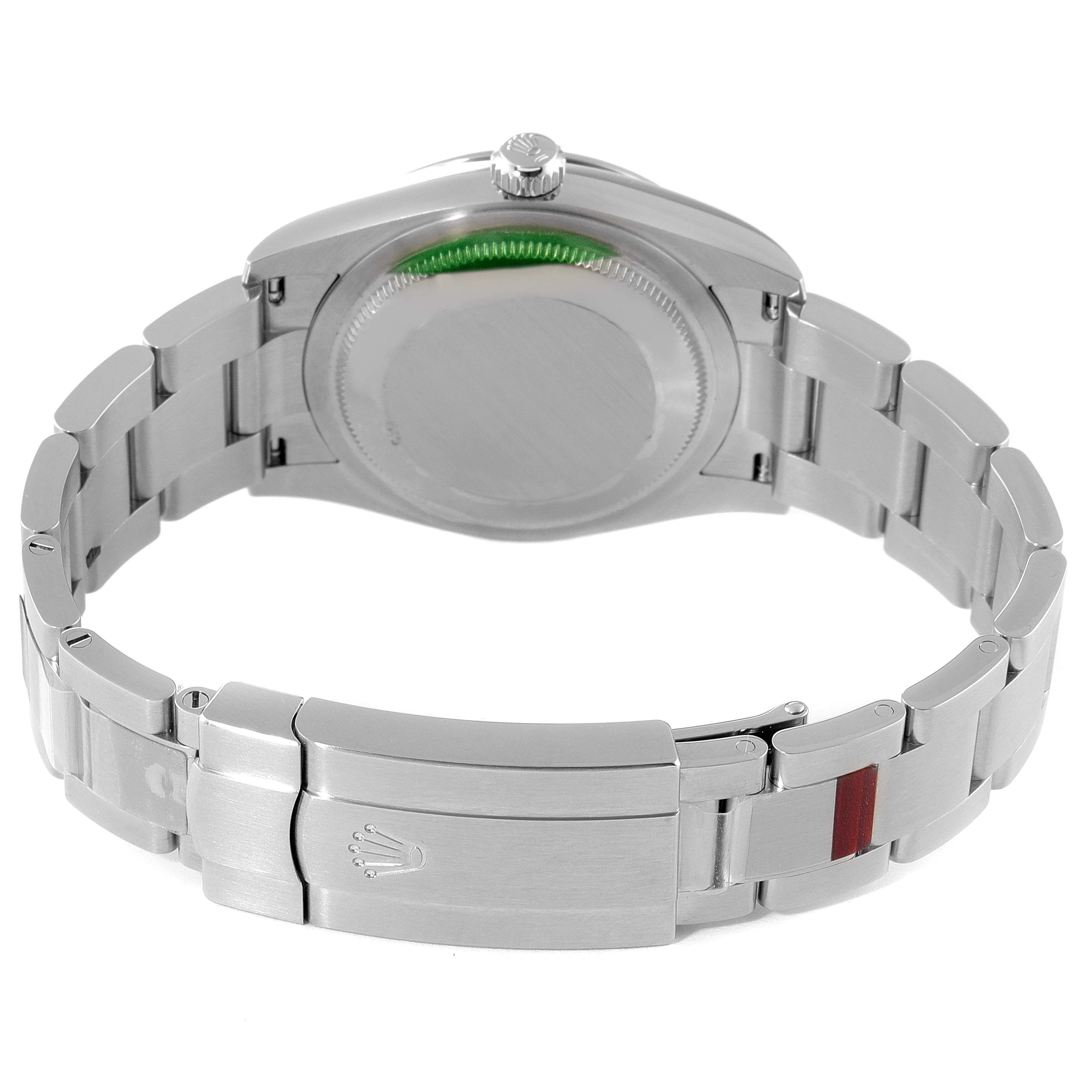 The image shows the back of a Rolex Oyster Perpetual 124200 Men
s Stainless Steel Blue Dial 124200 Men
s Stainless Steel Blue Dial watch and its metal bracelet with the clasp closed.