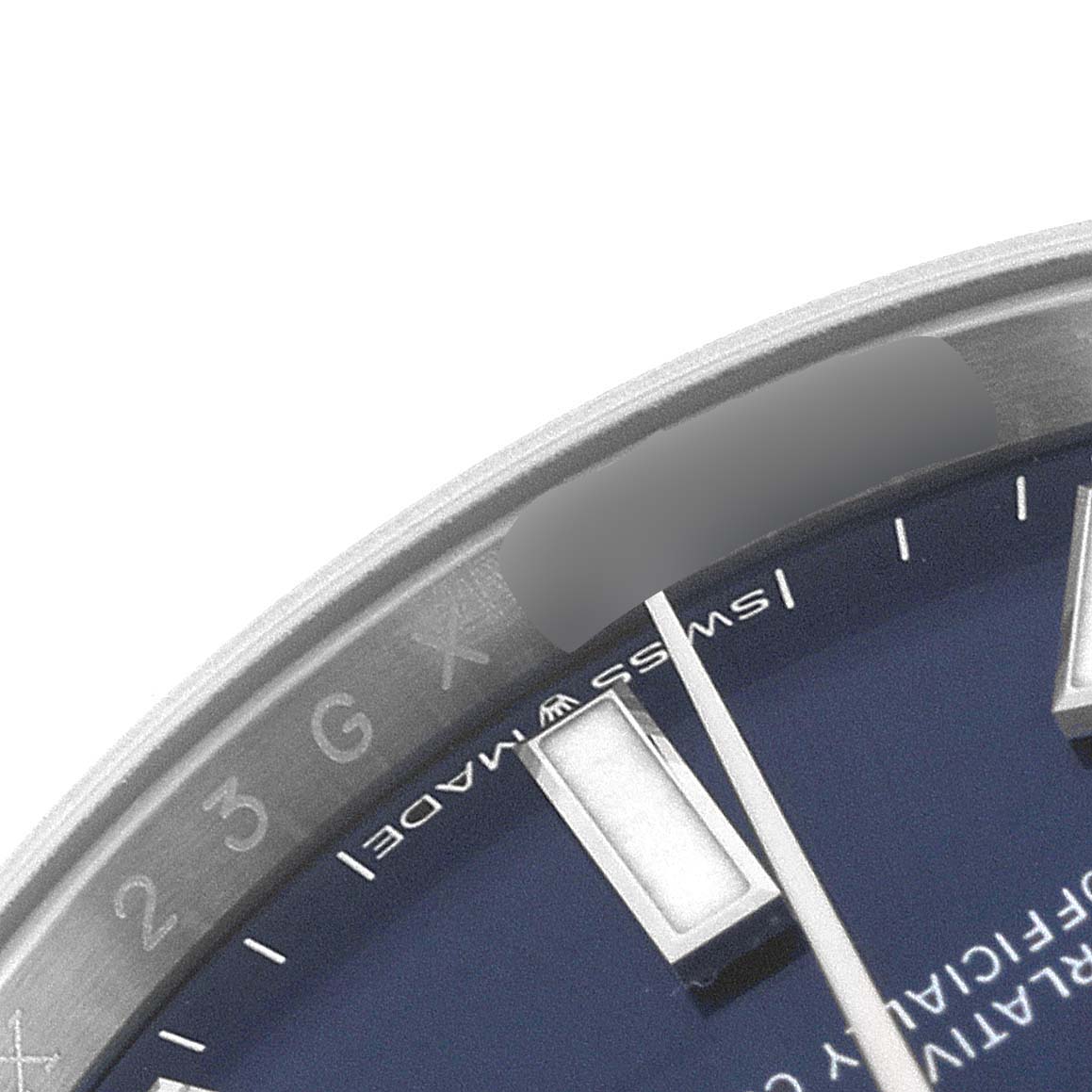 The image shows a close-up of the dial and bezel of the Rolex Oyster Perpetual 124200 Men
s Stainless Steel Blue Dial 124200 Men
s Stainless Steel Blue Dial watch, highlighting part of the blue face and hour markers.