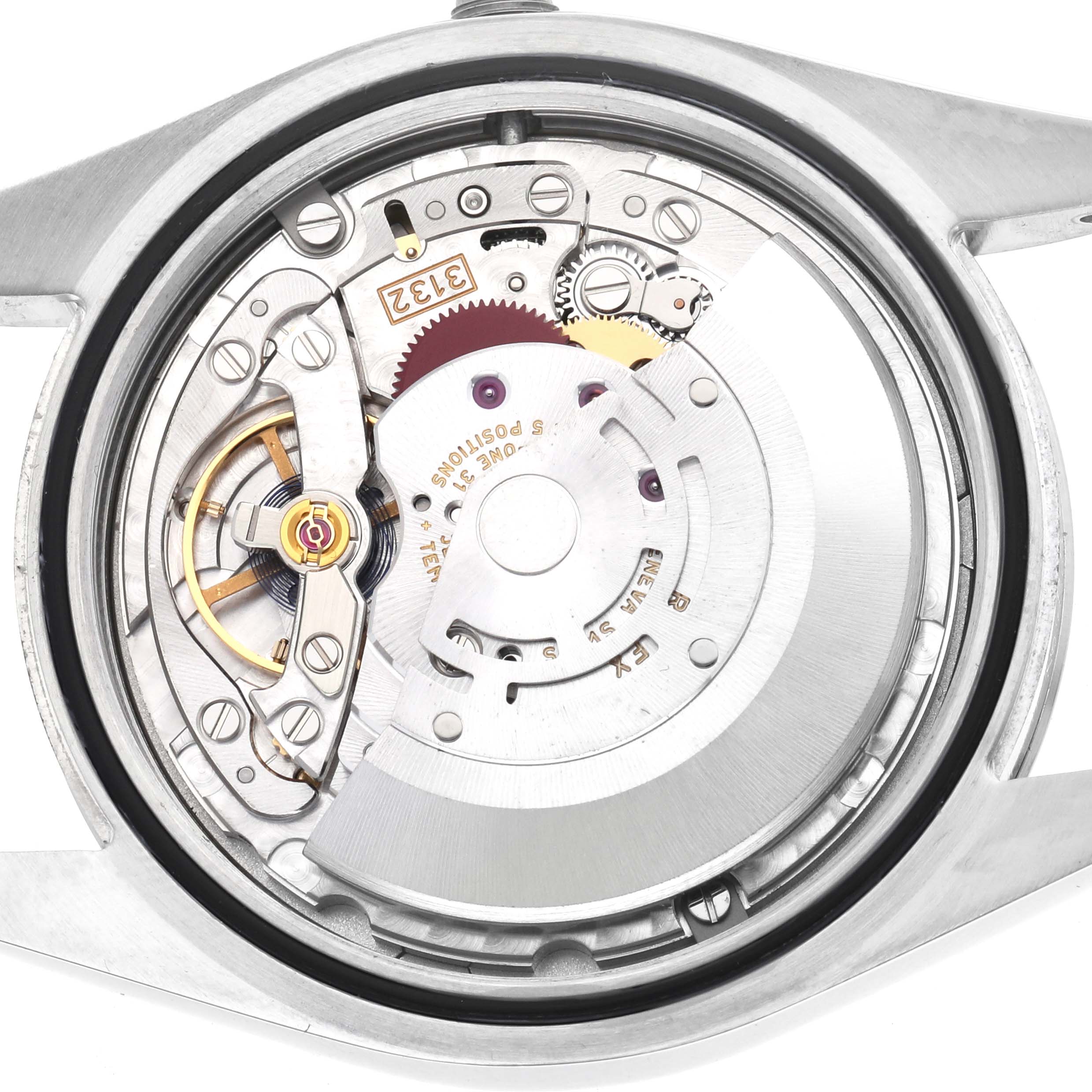 The image shows a close-up of the Rolex Oyster Perpetual 114300 Men's Stainless Steel Blue Dial's movement, highlighting gears and rotor from a back angle.