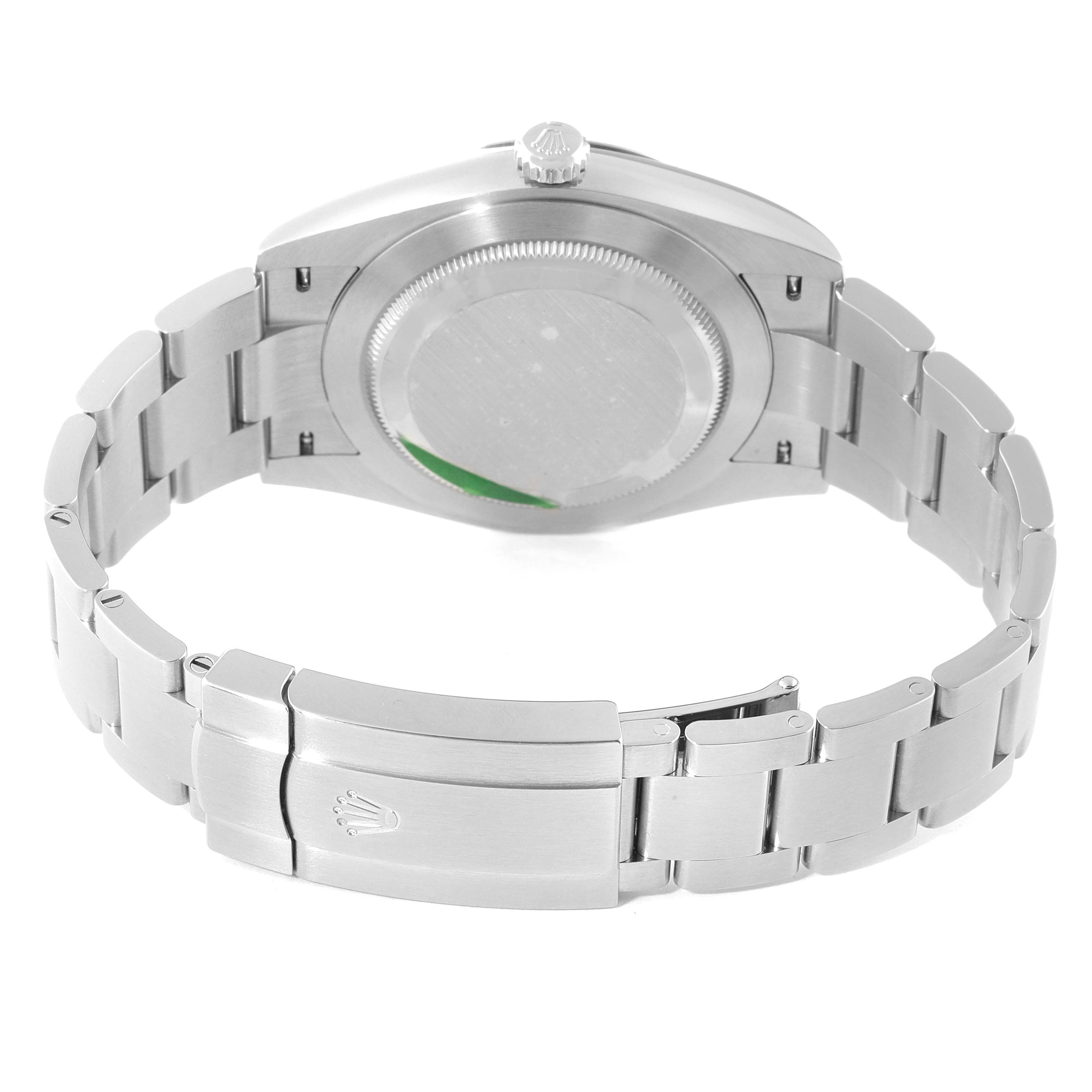 This image shows the backside of the Oyster Perpetual Rolex watch, highlighting the case back and bracelet clasp.