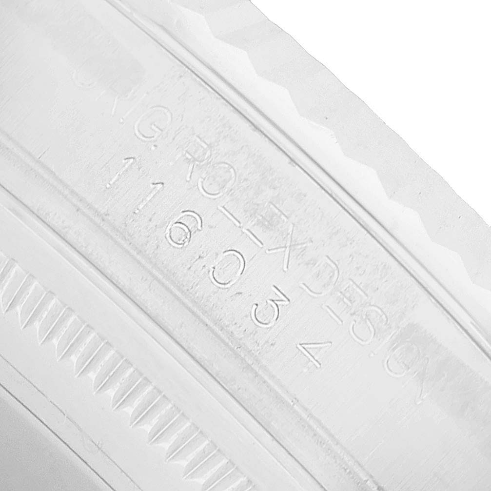 The image shows a close-up of the engraved inner bezel of a Rolex Oyster Perpetual 116034 Men's Stainless Steel Silver Dial watch, highlighting the model number.