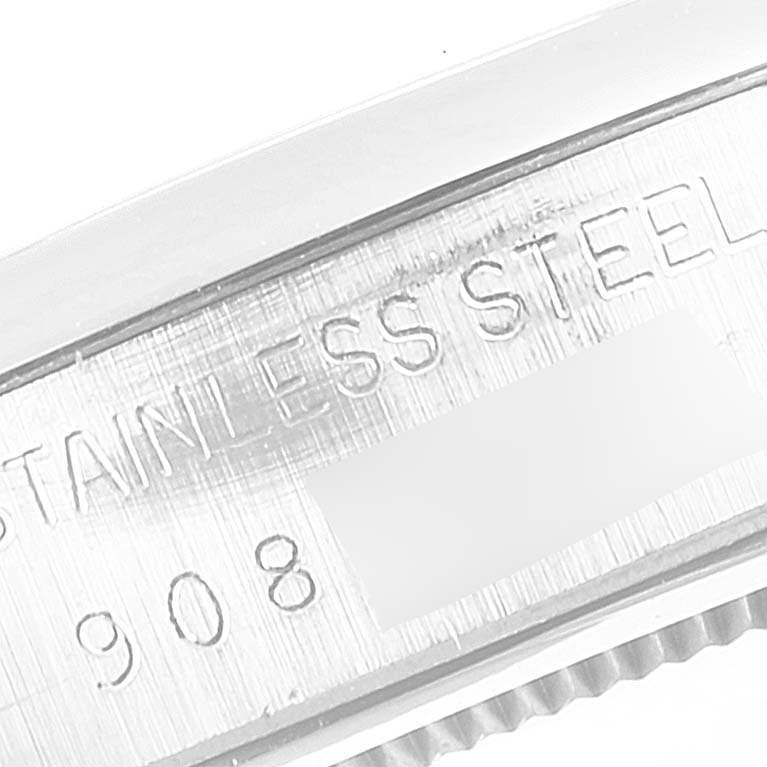 This image shows a close-up of the stainless steel caseback with partial engravings of a Rolex Vintage Collection 6694 Men's Stainless Steel Blue Dial 6694 Men's Stainless Steel Blue Dial watch.