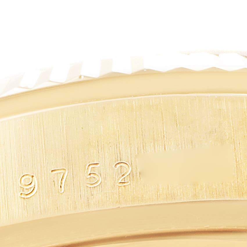 This image shows a close-up of the serial number engravings on the case of a Rolex President 18038 Men's Yellow Gold Champagne Dial 18038 Men's Yellow Gold Champagne Dial model watch.