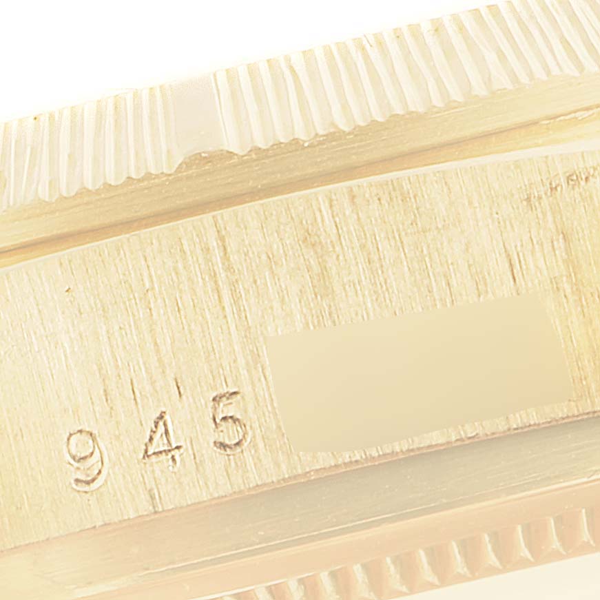 This image shows a close-up of the edge and the engraved numbers on the bezel of a Rolex President 18078 Men
s Yellow Gold Champagne Dial 18078 Men
s Yellow Gold Champagne Dial model watch.