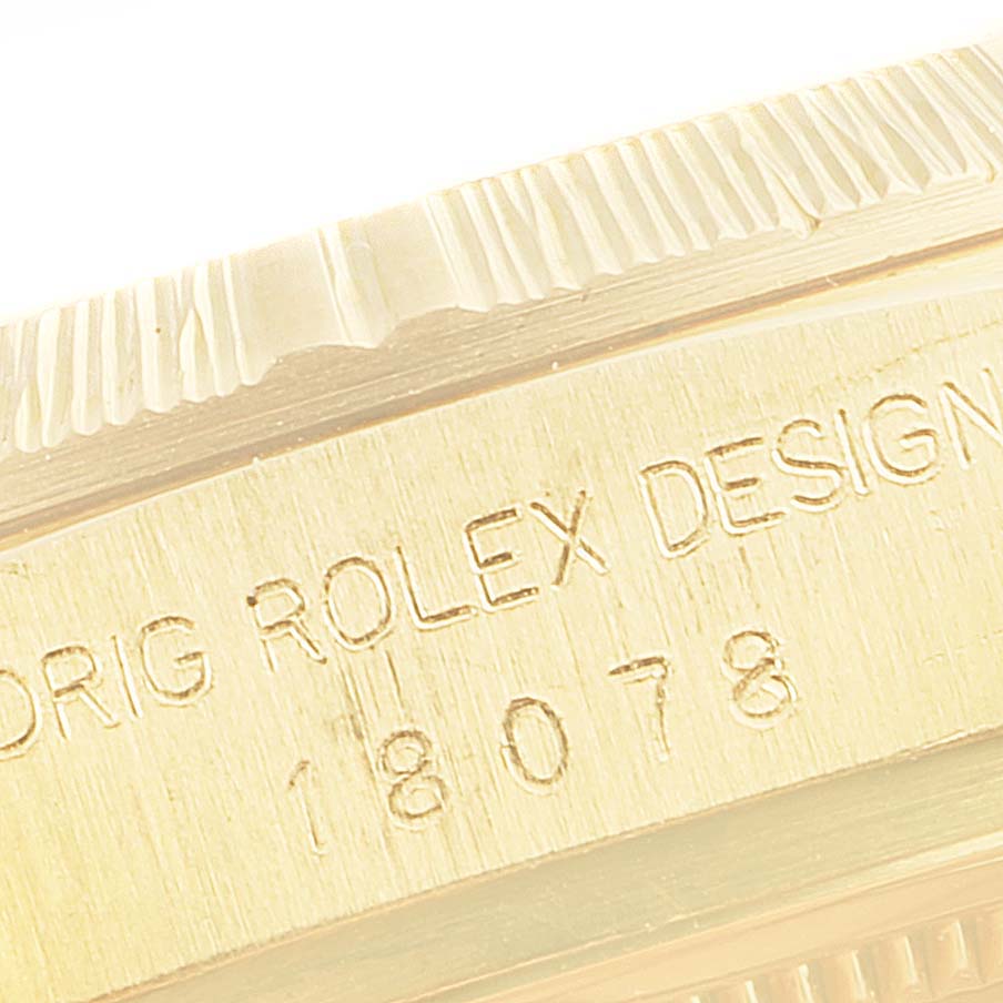 This close-up image shows the edge of the case and engraved serial number of a Rolex President 18078 Men
s Yellow Gold Champagne Dial 18078 Men
s Yellow Gold Champagne Dial model watch.