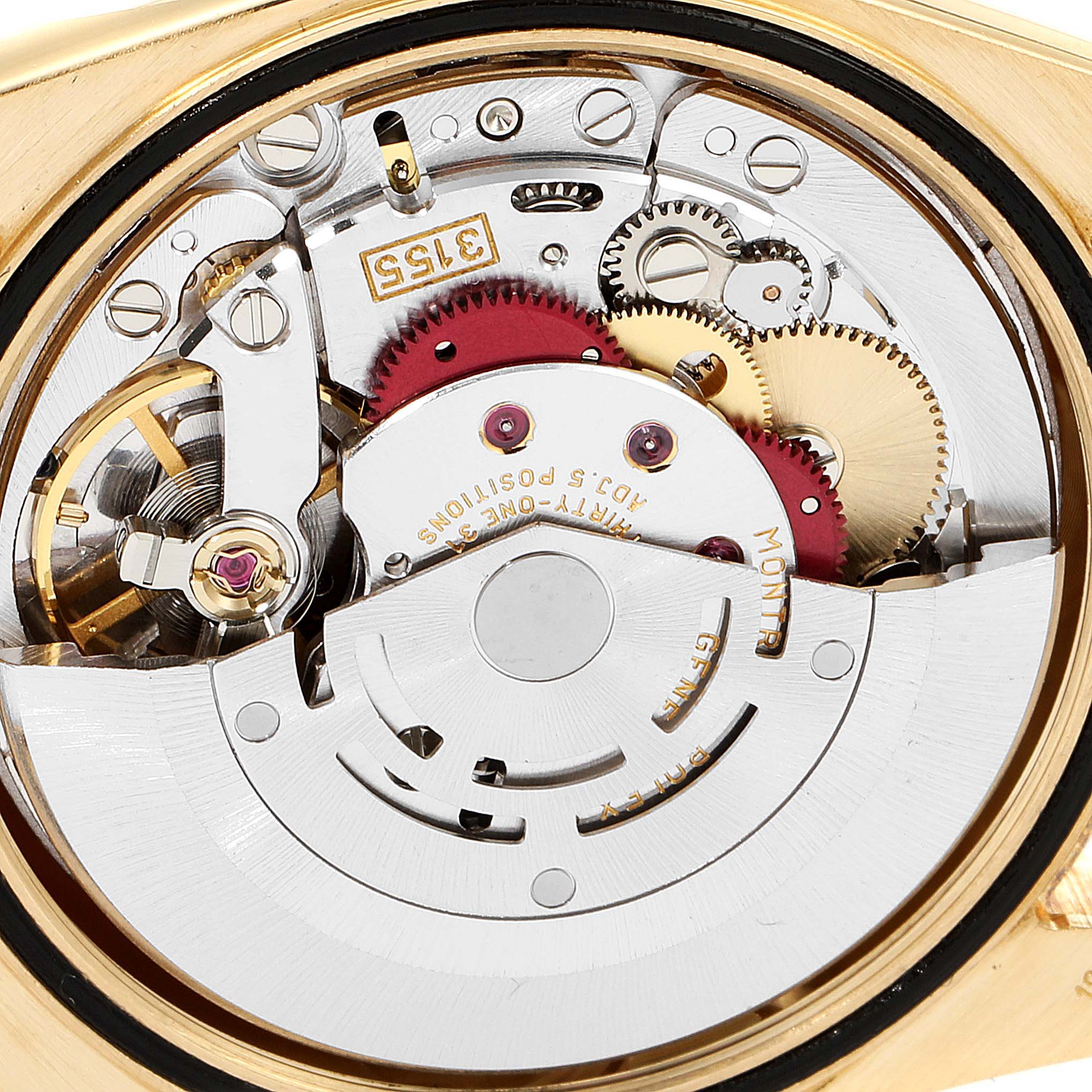 This is a close-up view of the inner mechanism of the Rolex President 118238 Men
s Yellow Gold Champagne Dial 118238 Men
s Yellow Gold Champagne Dial model watch, showing its gears and movement components.