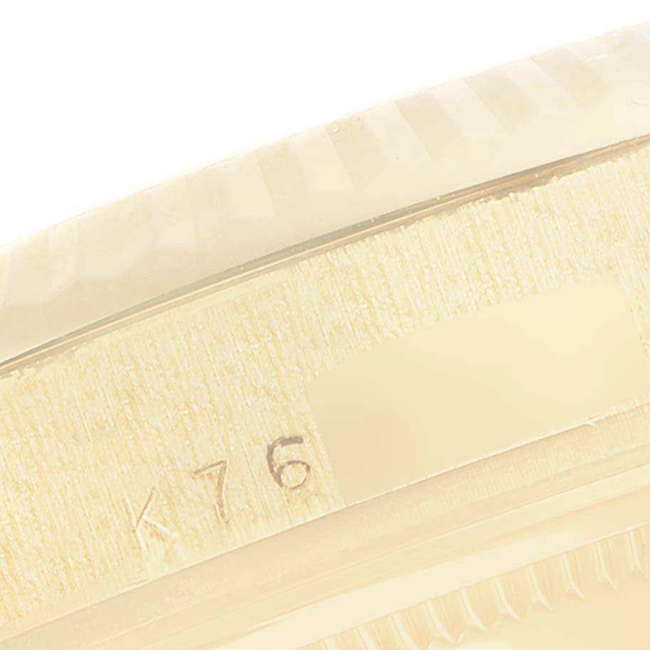 This image shows a close-up of the case back and part of the serial number of a Rolex President 118238 Men
s Yellow Gold Champagne Dial 118238 Men
s Yellow Gold Champagne Dial model watch.