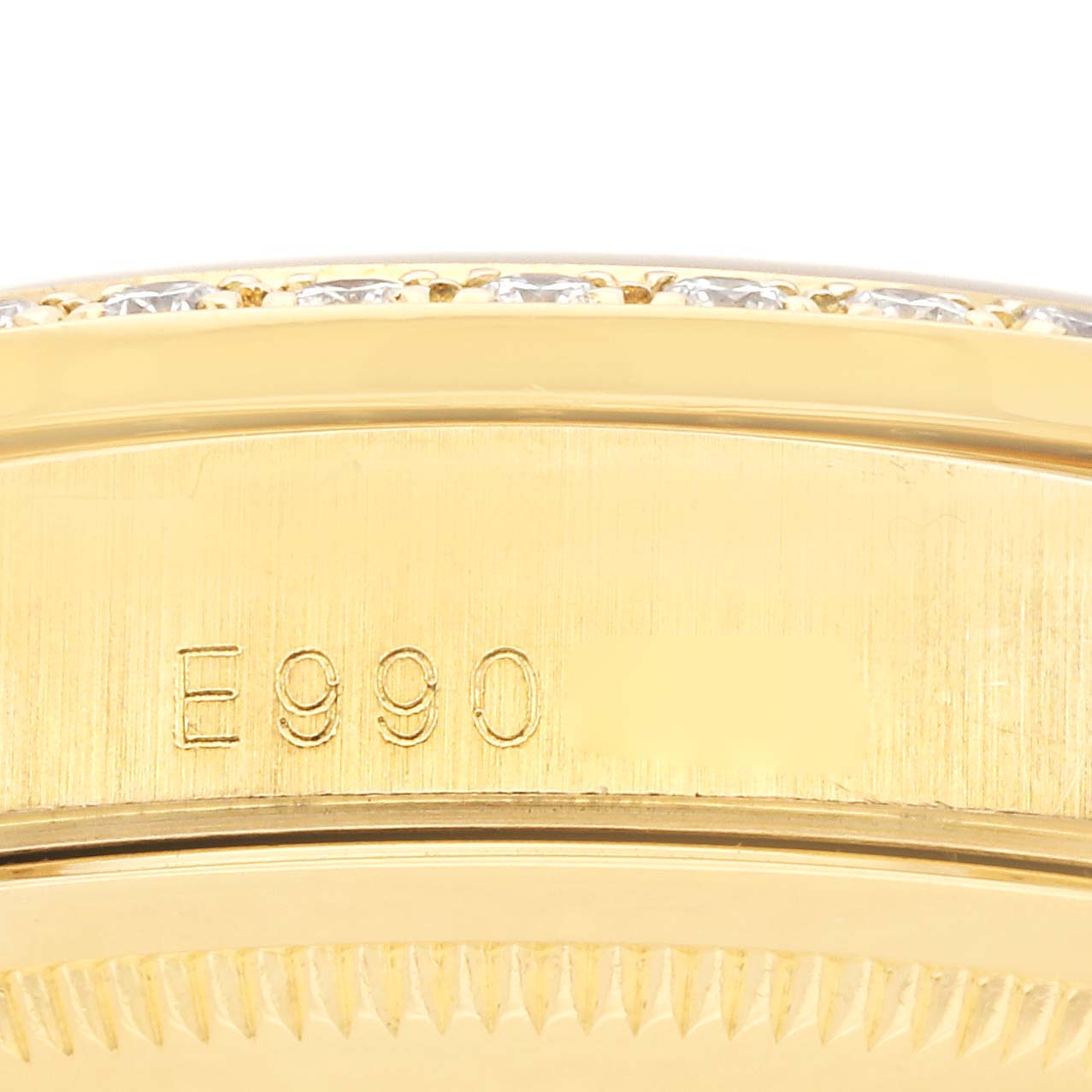 The image shows a close-up of the case edge and bezel with serial engraving on the Rolex President 18388 Men's Yellow Gold Grey Dial 18388 Men's Yellow Gold Grey Dial model.