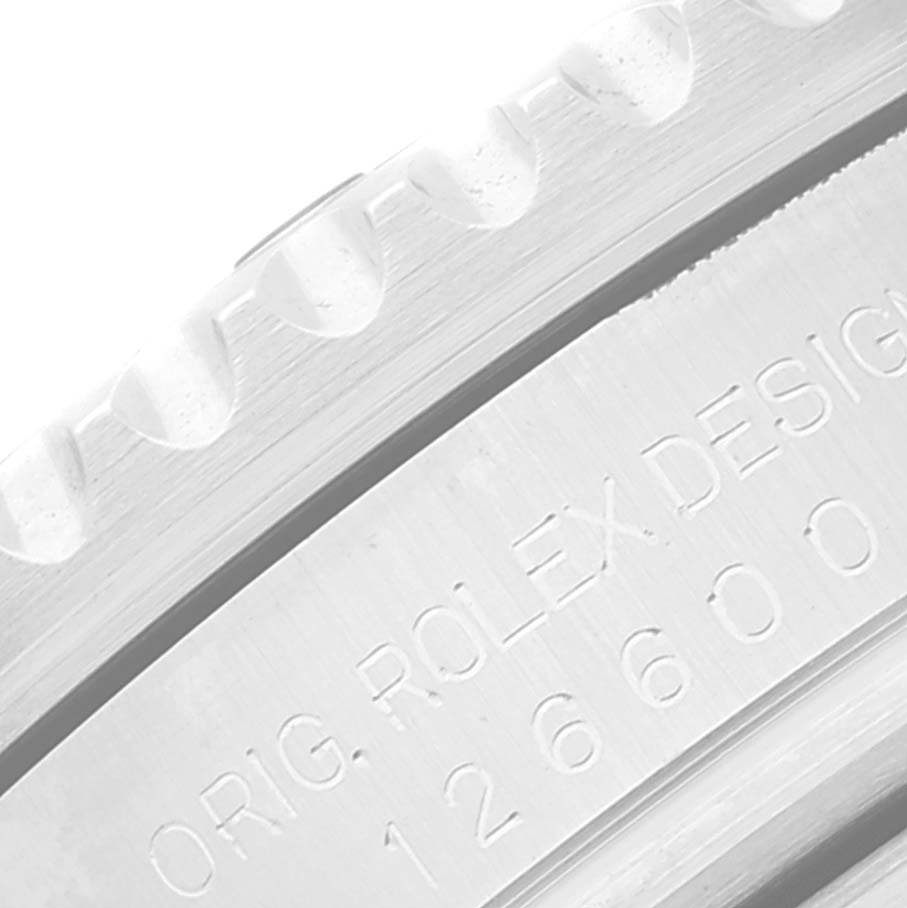 This image shows a close-up of the engraved bezel and serial number on a Rolex Sea-Dweller 126600 Men's Stainless Steel Black Dial 126600 Men's Stainless Steel Black Dial watch.