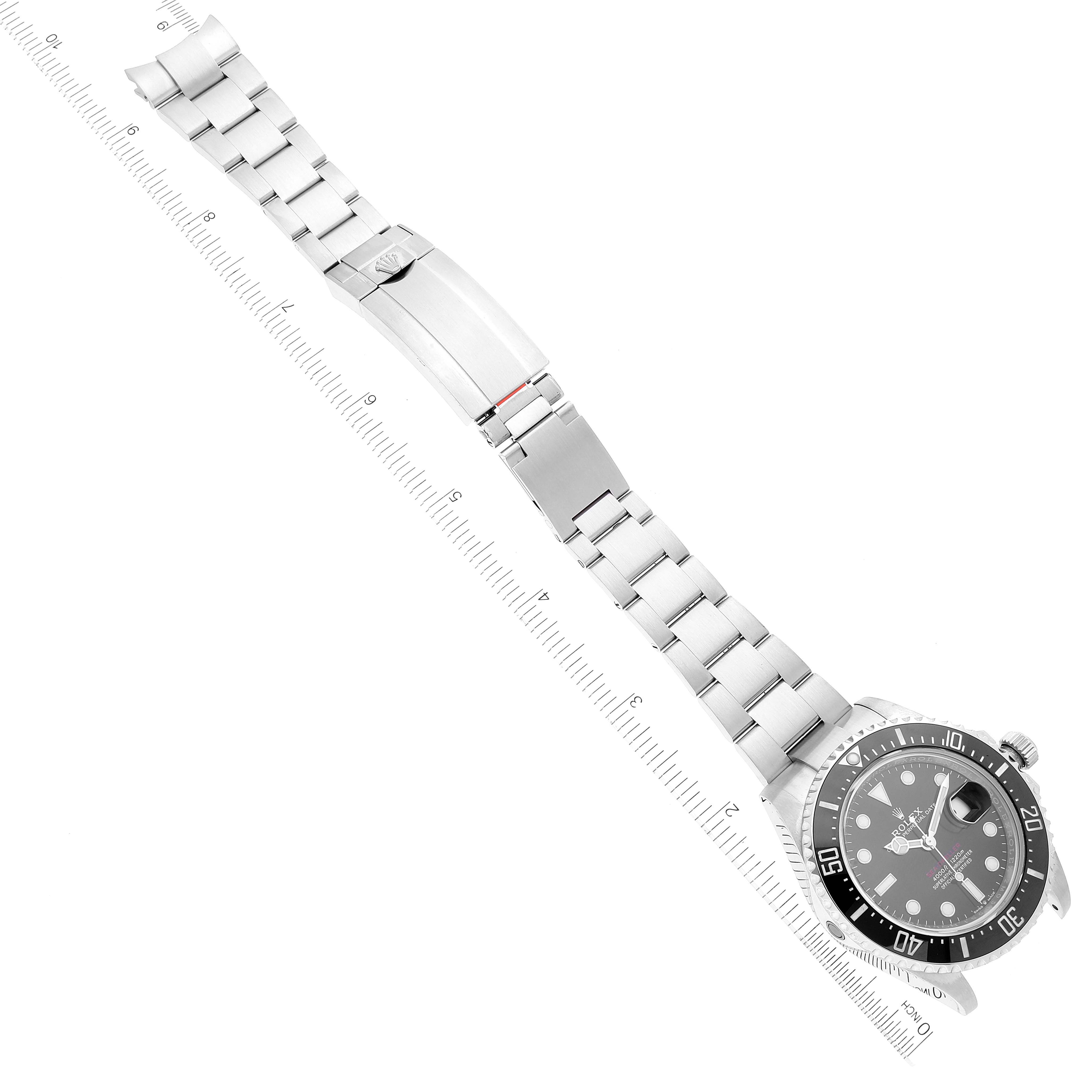 The image shows the Rolex Sea-Dweller 126600 Men's Stainless Steel Black Dial 126600 Men's Stainless Steel Black Dial watch laid flat, displaying its face, bezel, and bracelet with the clasp opened.