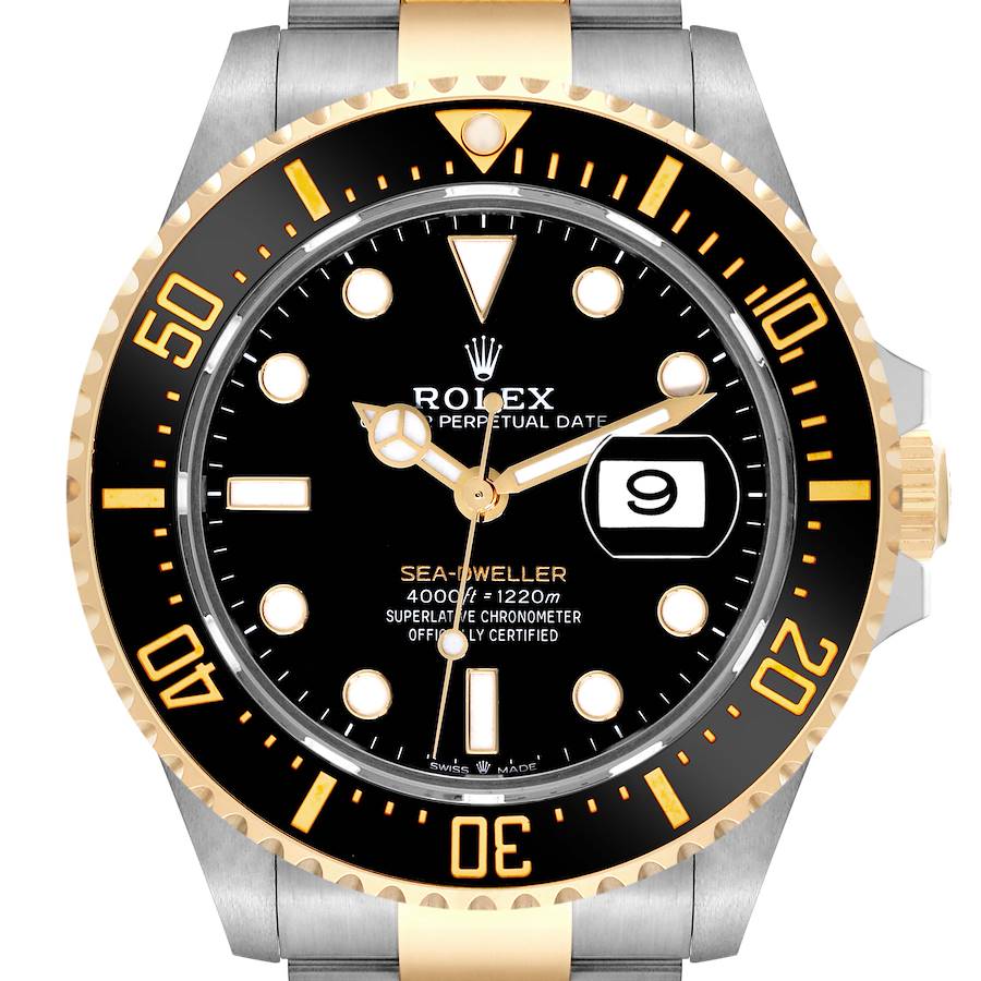 The Rolex Sea-Dweller watch is shown from the front, highlighting the bezel, dial, date window, and part of the bracelet.