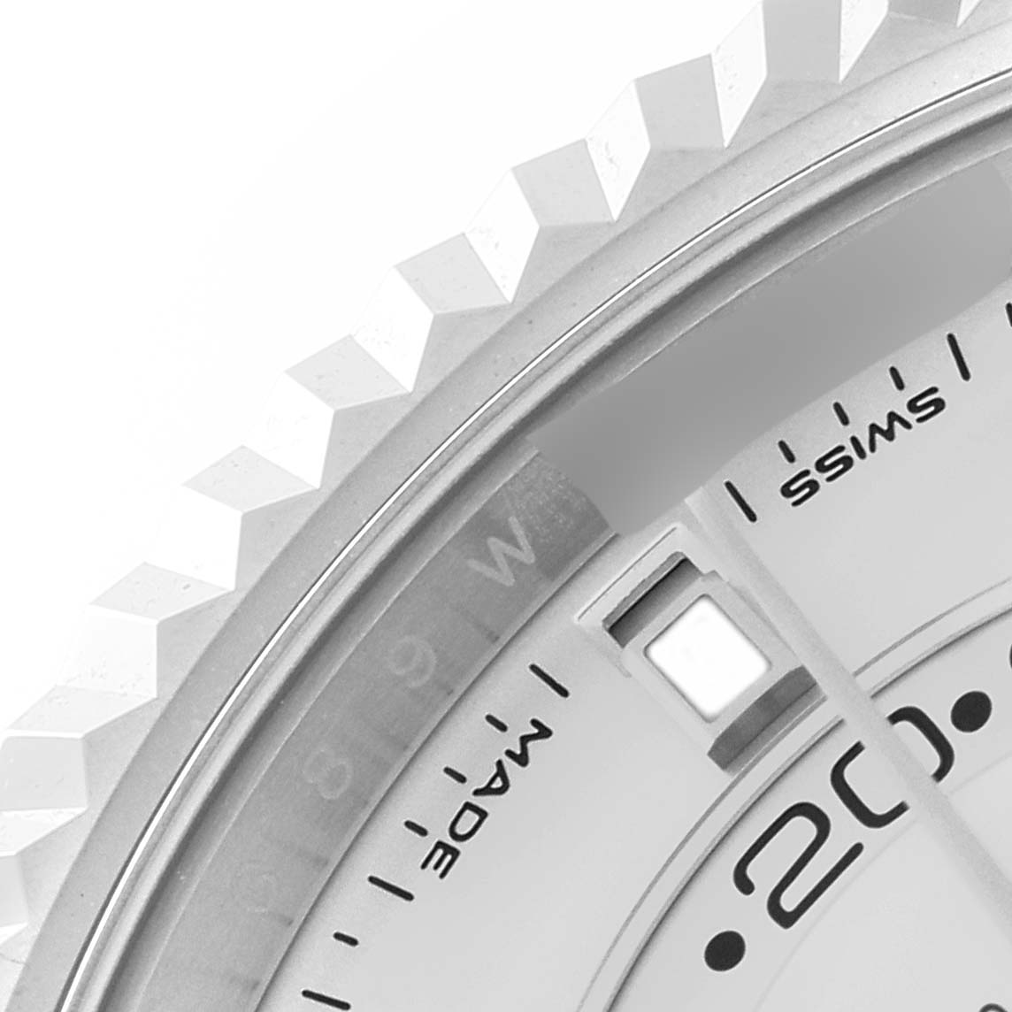 The close-up image shows the bezel and part of the dial of a Rolex Sky-Dweller 326934 Men's Stainless Steel White Dial 326934 Men's Stainless Steel White Dial watch.