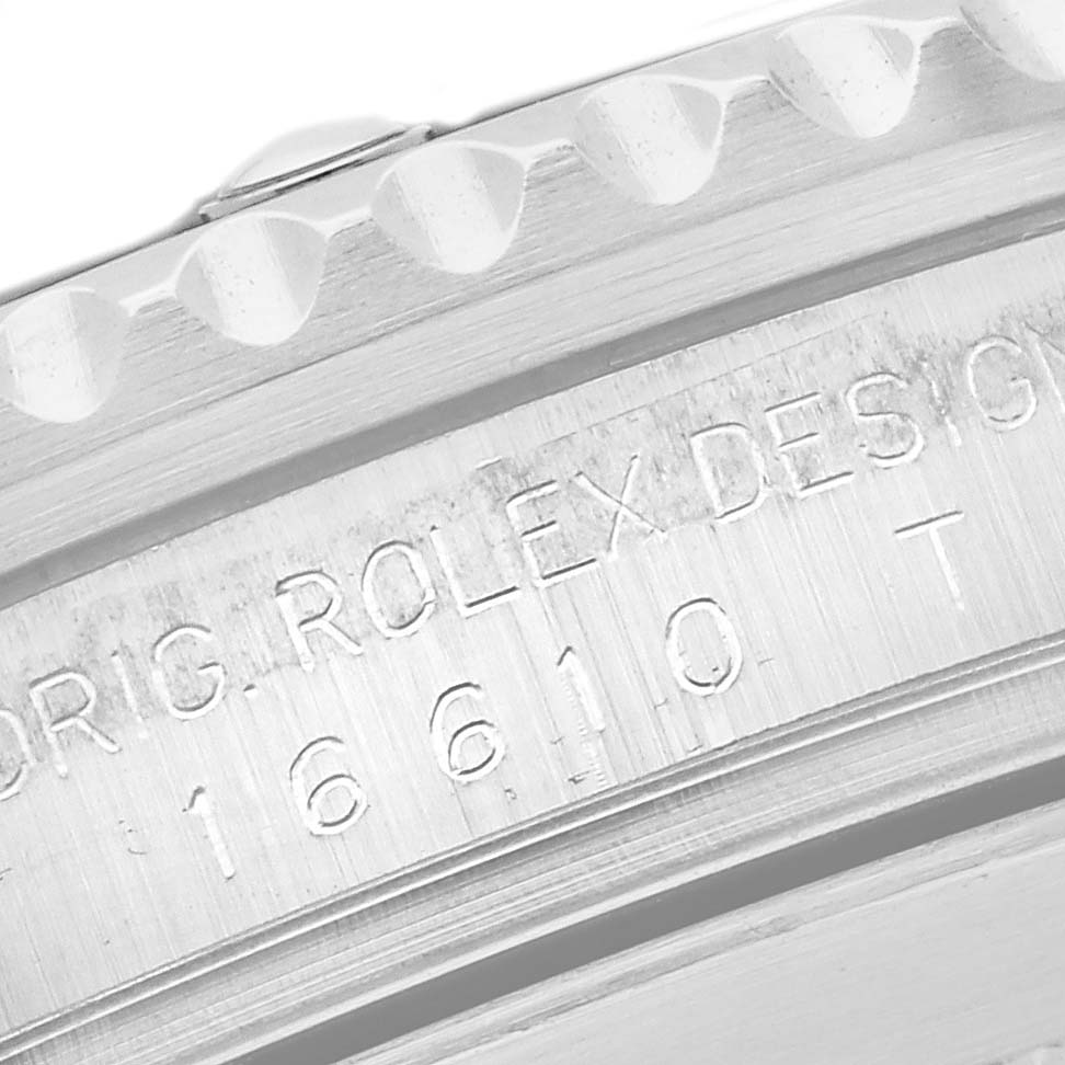 The image shows a close-up angle of the Rolex Submariner 16610 T Men's Stainless Steel Black Dial 16610 T Men's Stainless Steel Black Dial's side case with engravings.
