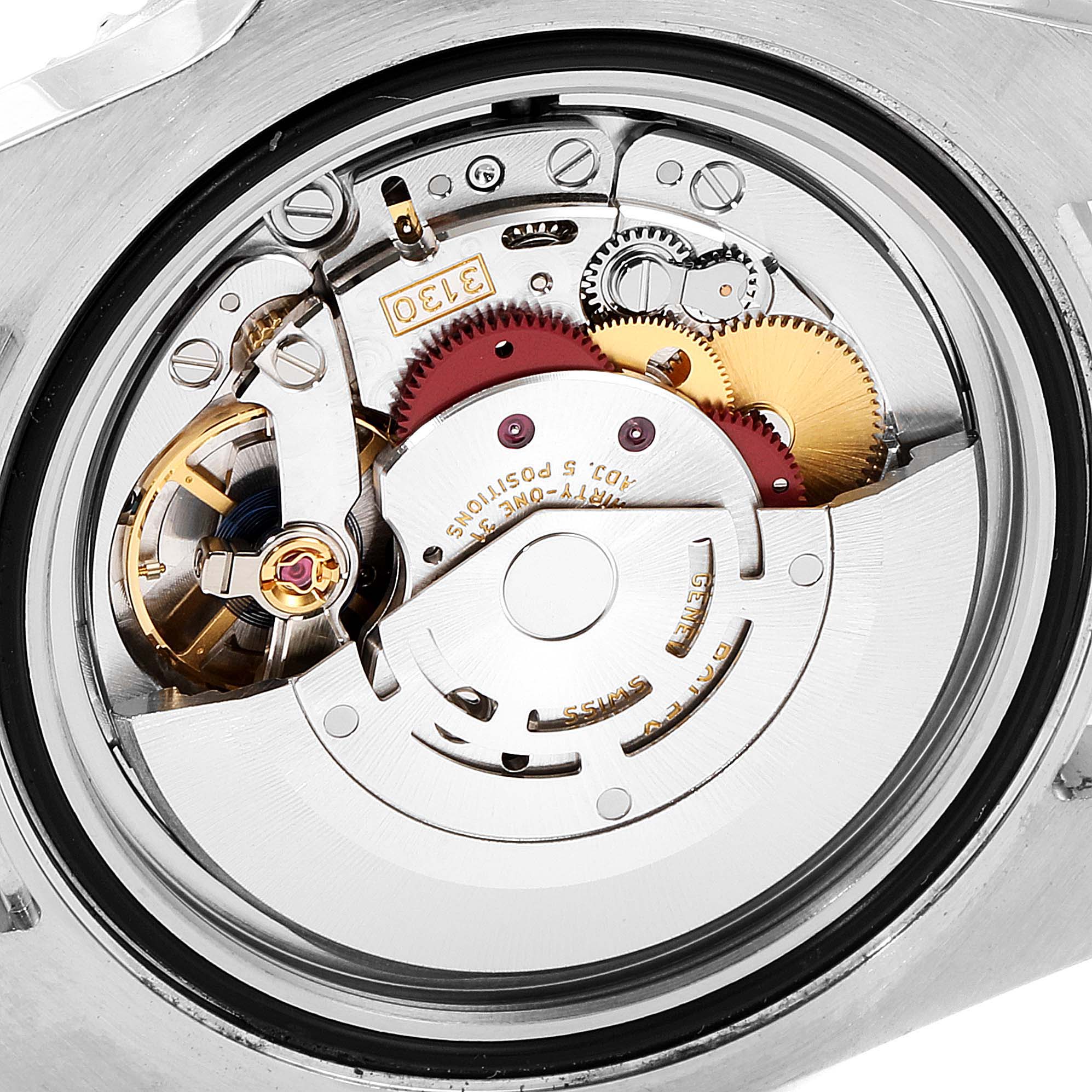 The image shows a close-up view of the Rolex Submariner 114060 Men
s Stainless Steel Black Dial 114060 Men
s Stainless Steel Black Dial
s intricate internal mechanical movement components from the back.