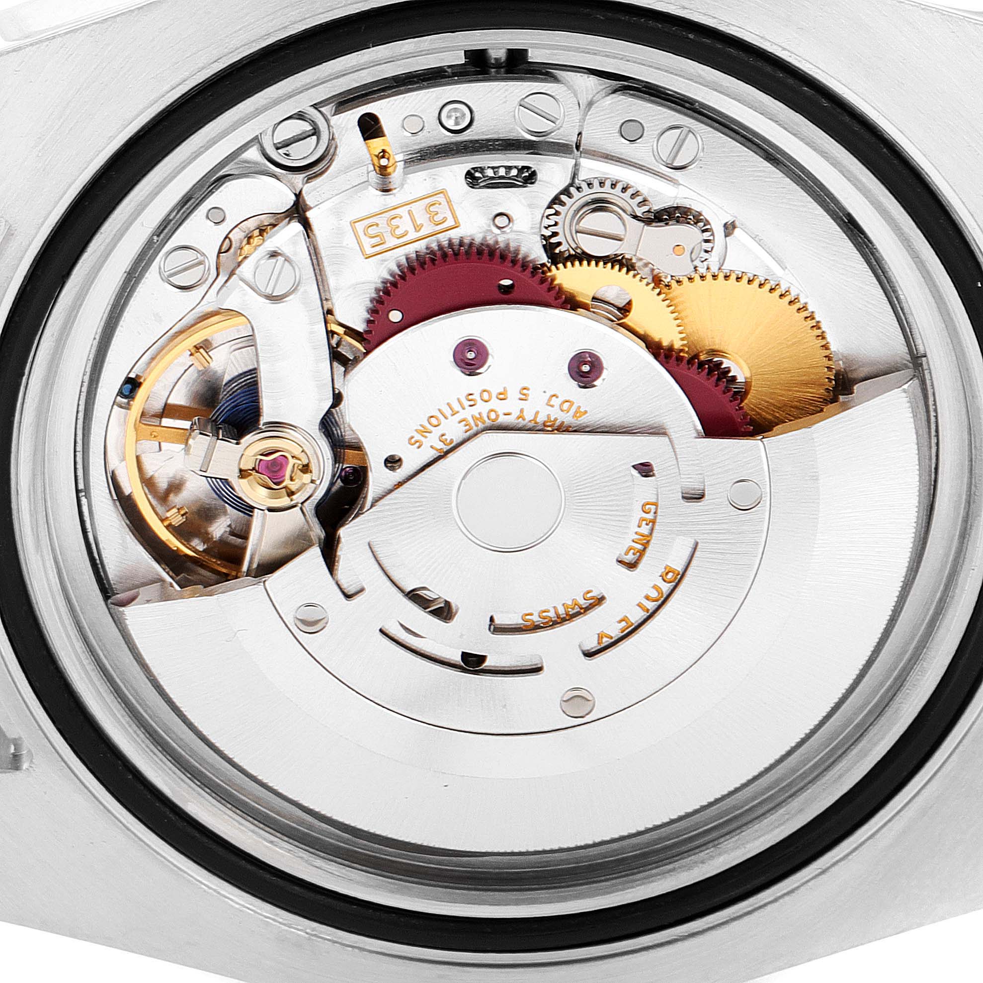 The image shows a close-up view of the movement inside a Rolex Submariner 116610 Men
s Stainless Steel Black Dial 116610 Men
s Stainless Steel Black Dial watch.