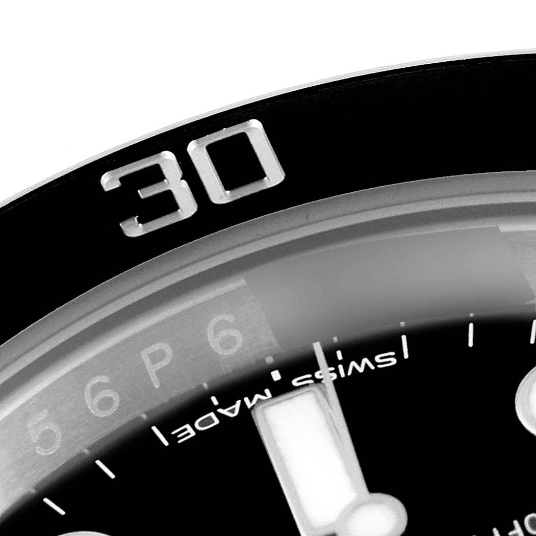 The image shows a close-up of the bezel and part of the dial of a Rolex Submariner 116610LN Men
s Stainless Steel Black Dial 116610LN Men
s Stainless Steel Black Dial watch, highlighting the "30" marker.