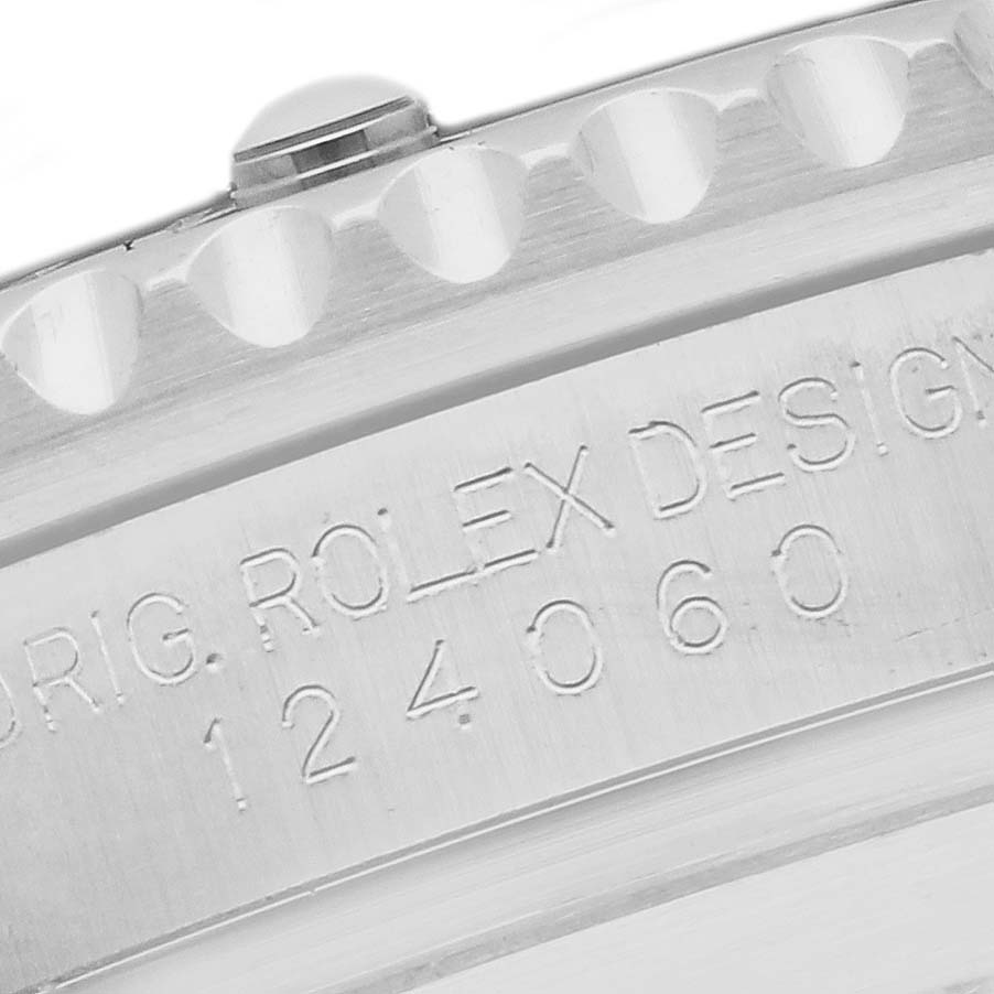 The image shows the side view of a Rolex Submariner 124060 Men's Stainless Steel Black Dial 124060 Men's Stainless Steel Black Dial, highlighting the engraved design and serial number on the bezel.