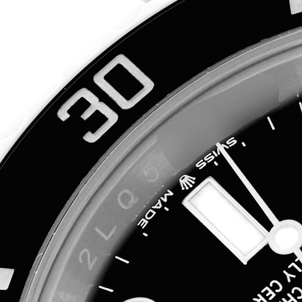 The image shows a close-up of the bezel and part of the dial of a Rolex Submariner 124060 Men's Stainless Steel Black Dial 124060 Men's Stainless Steel Black Dial watch, focusing on the 30-minute mark.