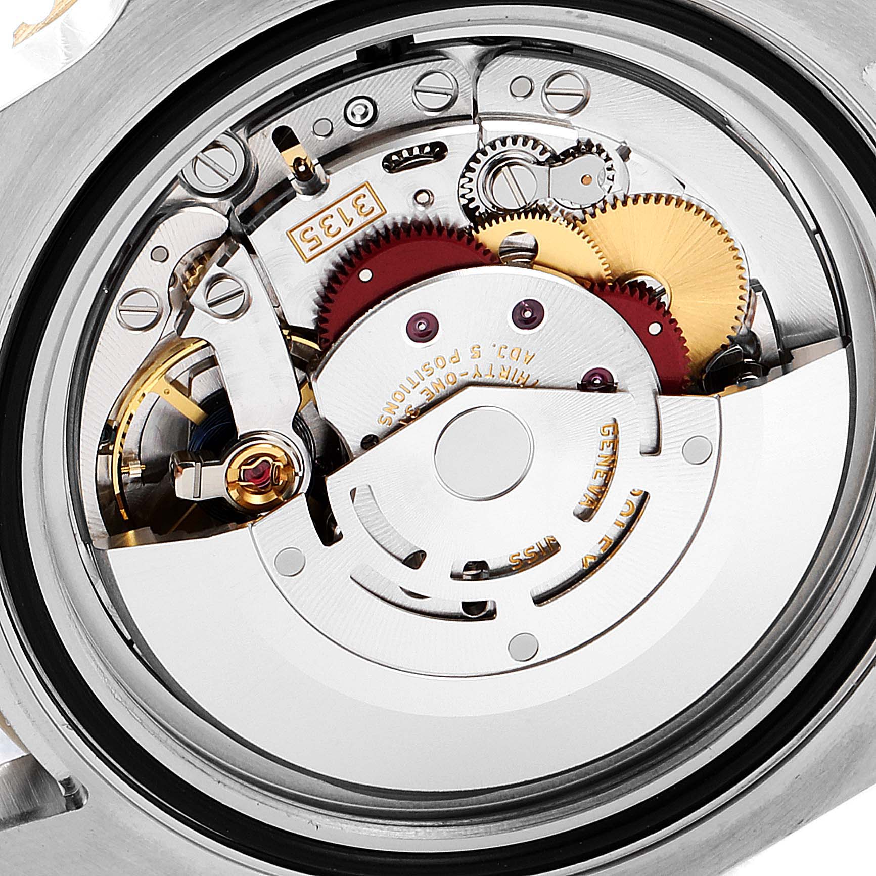 Close-up of the Rolex Submariner 116613 Men's Steel and Gold (two tone) Black Dial 116613 Men's Steel and Gold (two tone) Black Dial's internal movement and gears from the back.