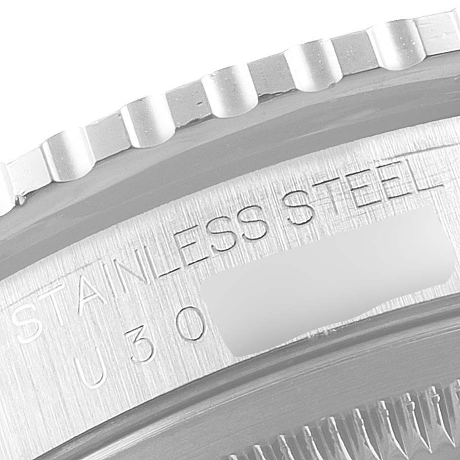 This image shows a close-up of the bezel and part of the case back inscriptions on a Rolex Turn-o-Graph 16264 Men
s Stainless Steel Silver Dial 16264 Men
s Stainless Steel Silver Dial watch.