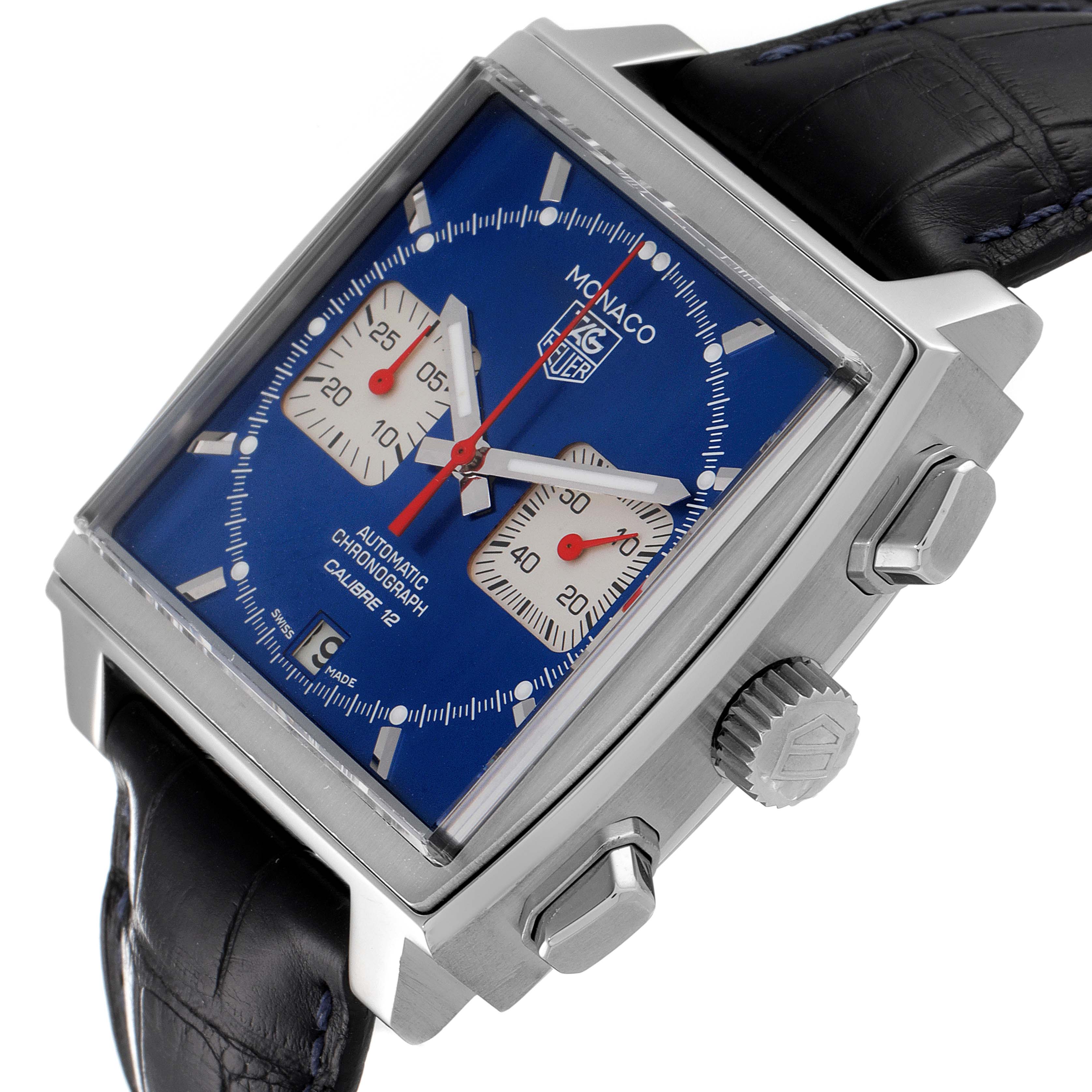 The image shows a Tag Heuer Monaco CAW2111 Men's Stainless Steel Blue Dial CAW2111 Men's Stainless Steel Blue Dial watch angled to highlight the face, crown, and pushers, with a visible black leather strap.