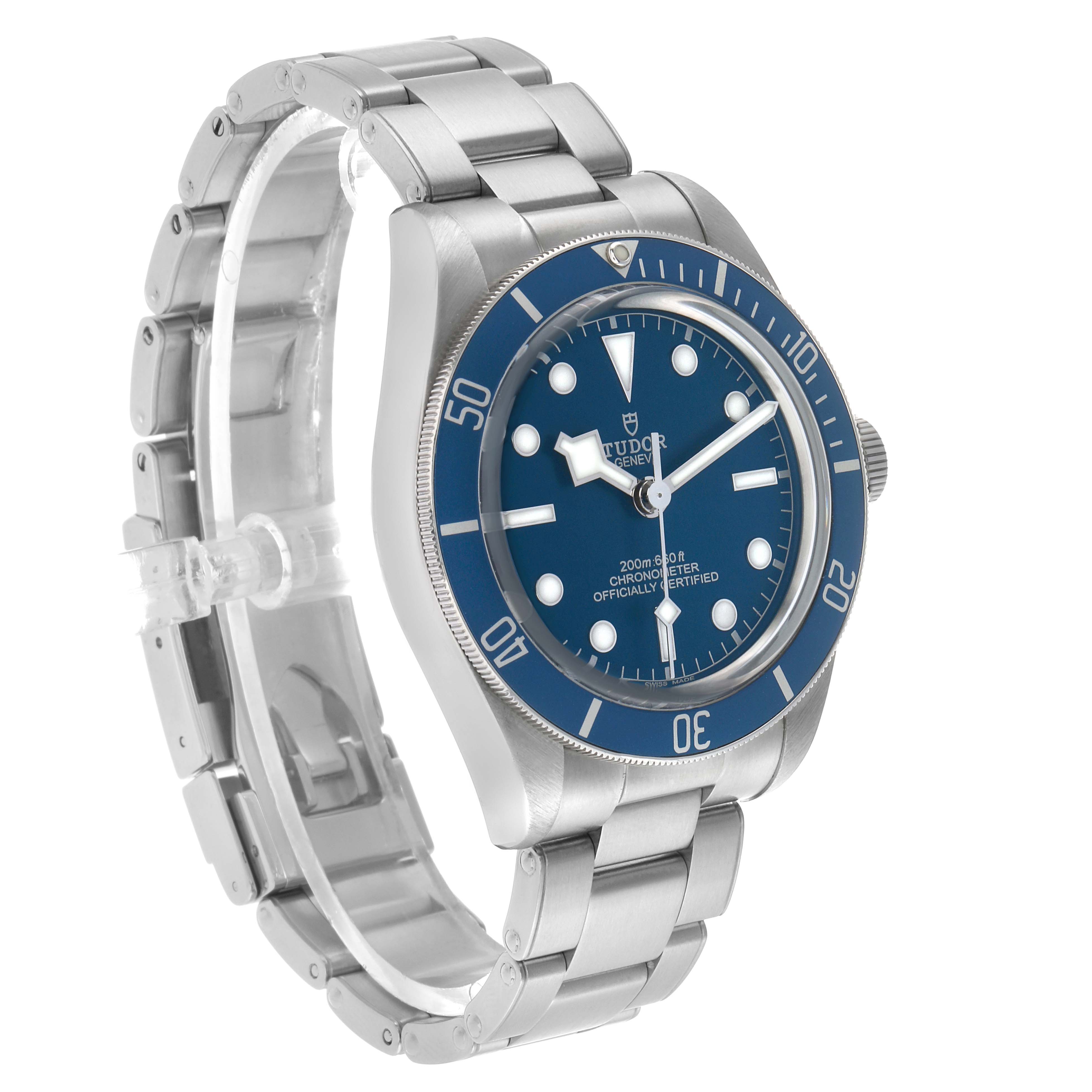 The Tudor Heritage Black Bay 79030B Men's Stainless Steel Blue Dial watch is shown at a slight angle, highlighting the blue dial, bezel, and bracelet.