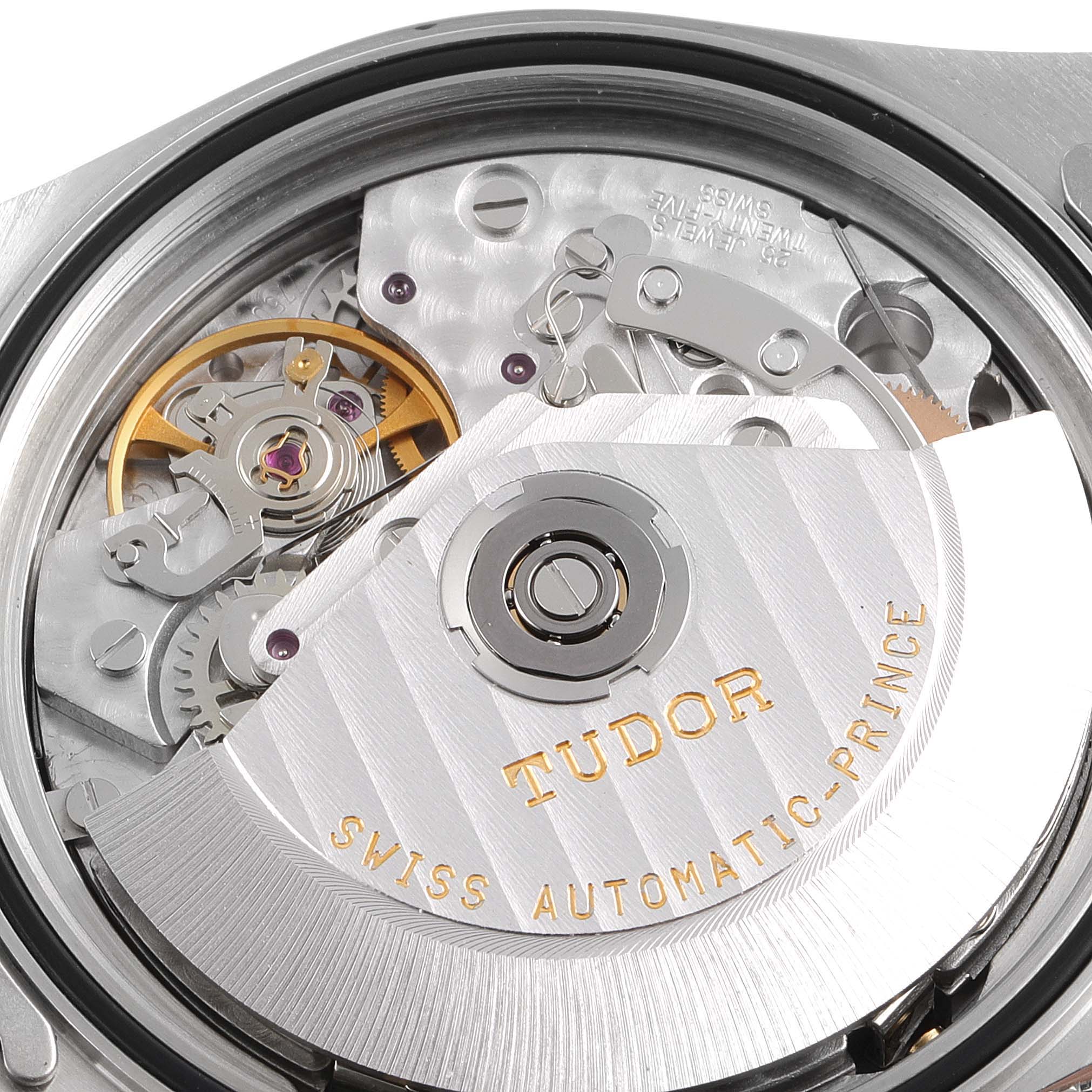 This is a close-up view of the movement inside a Tudor Prince model watch, showing intricate gears and the automatic rotor.