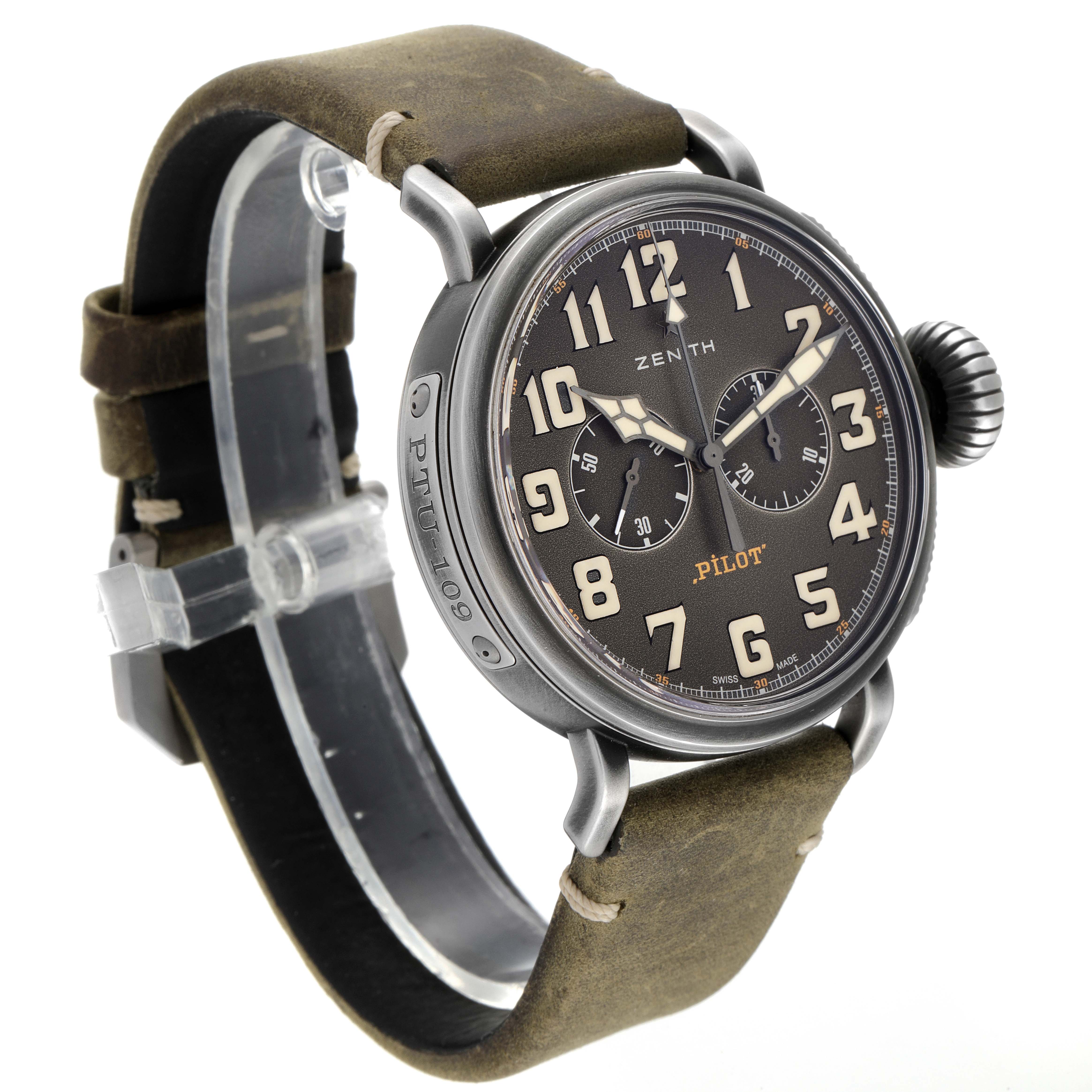 The image shows a Zenith Pilot 11.2430.4069/21.C773 Men's Stainless Steel Grey Dial 11.2430.4069/21.C773 Men's Stainless Steel Grey Dial model watch angled to display the face, lugs, crown, and partially the leather strap.