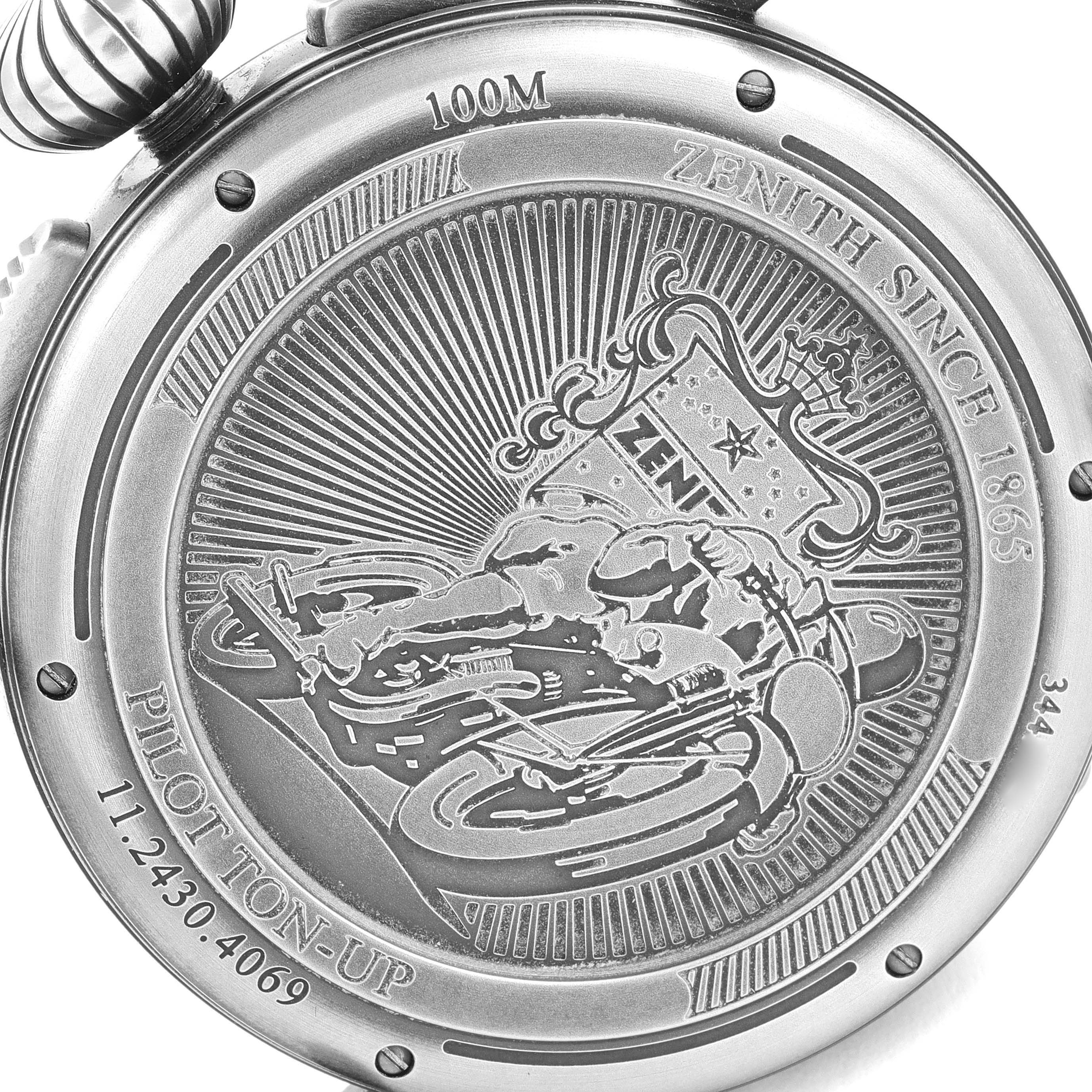 The image shows the back of the Zenith Pilot 11.2430.4069/21.C773 Men's Stainless Steel Grey Dial 11.2430.4069/21.C773 Men's Stainless Steel Grey Dial model watch, featuring an engraving of a rider and various inscriptions including "ZENITH SINCE 1865."