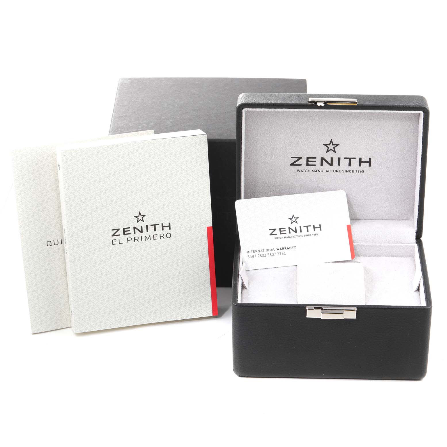The image shows the packaging accessories for a Zenith Pilot 11.2430.4069/21.C773 Men's Stainless Steel Grey Dial 11.2430.4069/21.C773 Men's Stainless Steel Grey Dial watch, including its box, warranty card, and manuals.