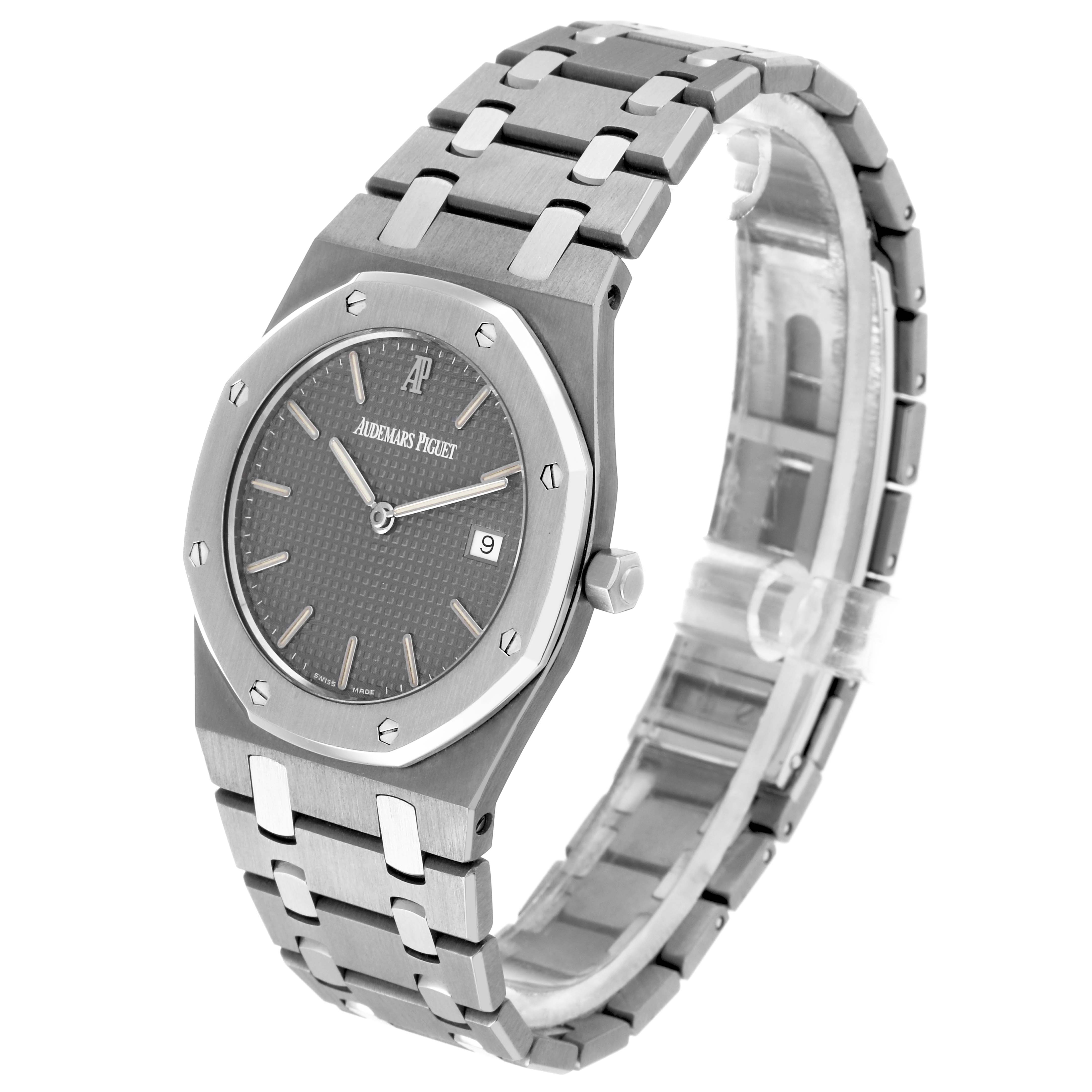 The image shows a Royal Oak by Audemars Piguet at a three-quarter angle, highlighting the bezel, dial, hands, and bracelet.