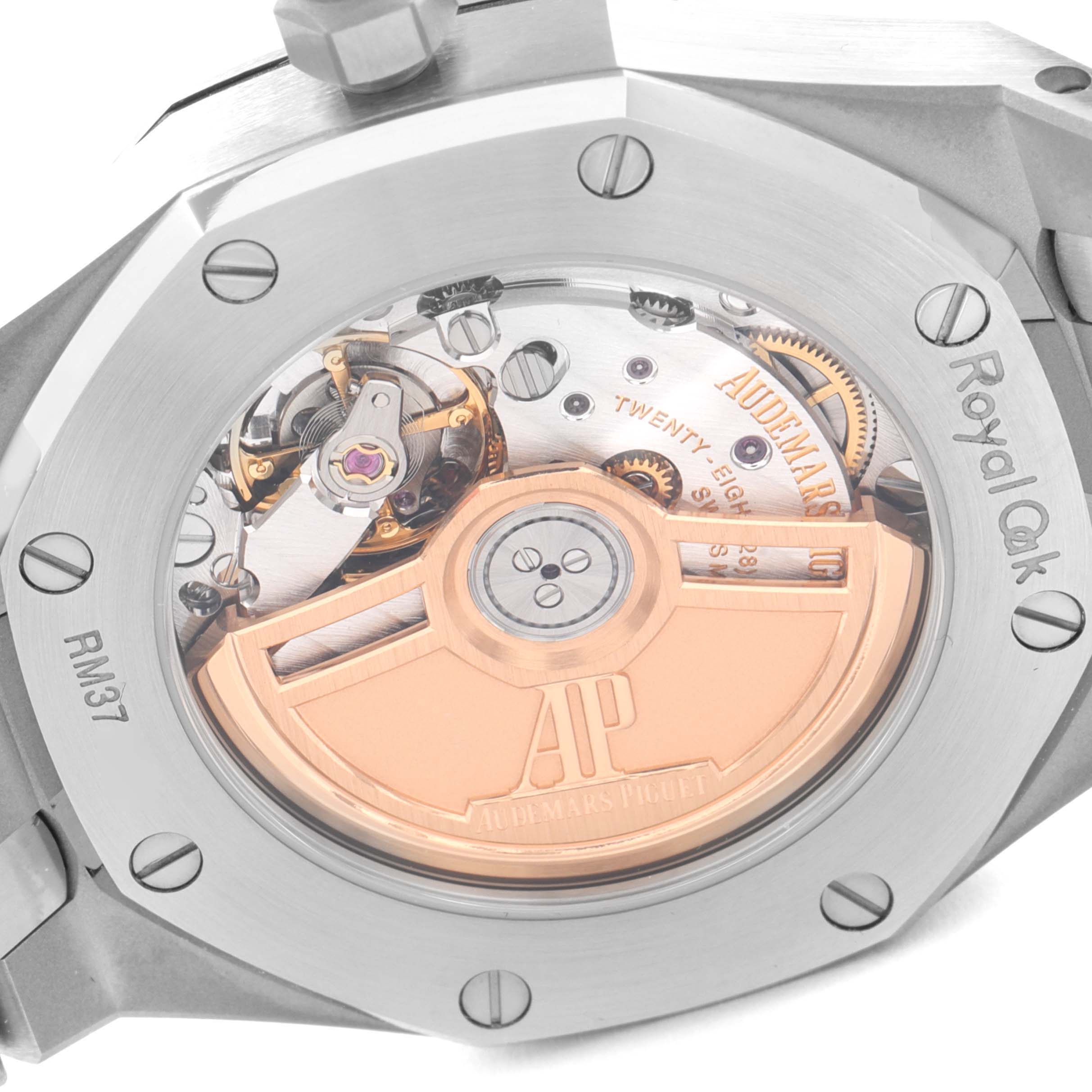 The image shows the back view of an Audemars Piguet Royal Oak 77350ST.OO.1261ST.01 Men's Stainless Steel White Dial 77350ST.OO.1261ST.01 Men's Stainless Steel White Dial watch, revealing the movement and parts of the rotor.