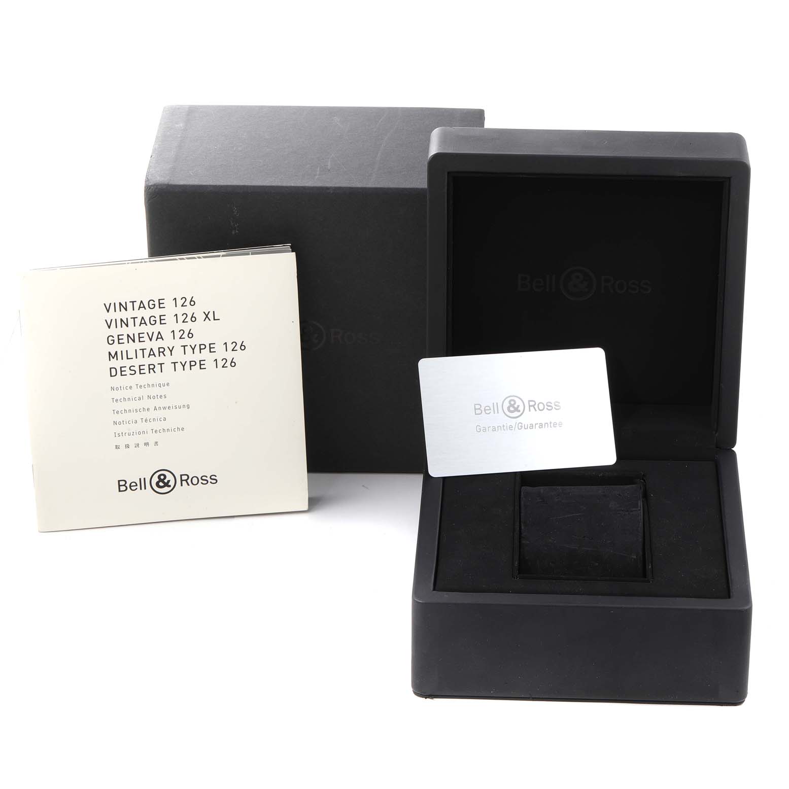 This image shows an opened Bell & Ross Heritage BRV126 Men's Stainless Steel Black Dial BRV126 Men's Stainless Steel Black Dial watch box, a warranty card, and a user manual.