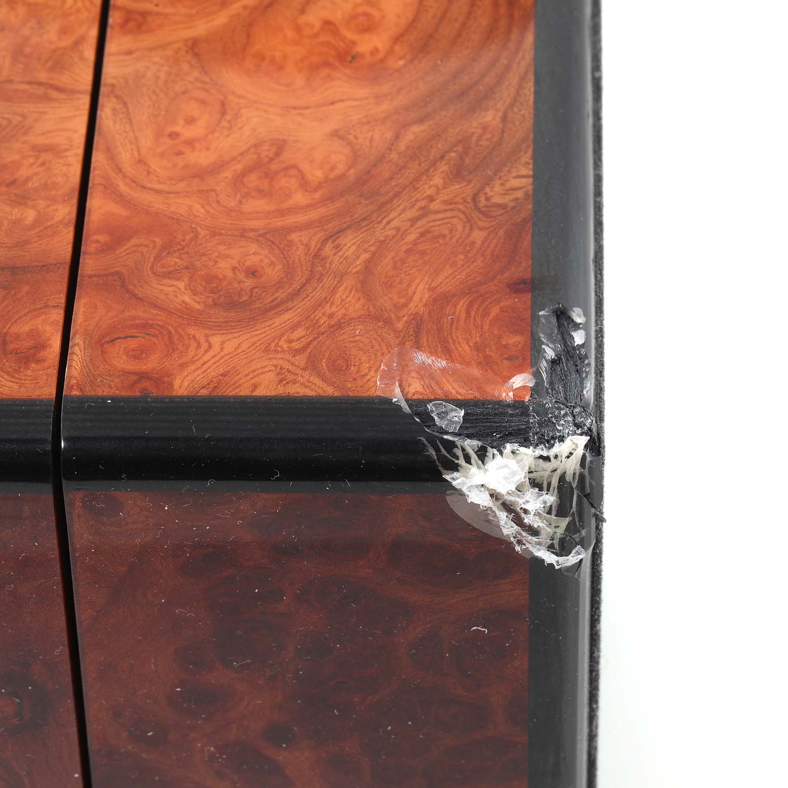 This is a close-up of a damaged corner of the presentation box for the Blancpain Villeret 6057-3642-55 Men's Rose Gold Silver Dial 6057-3642-55 Men's Rose Gold Silver Dial watch model.