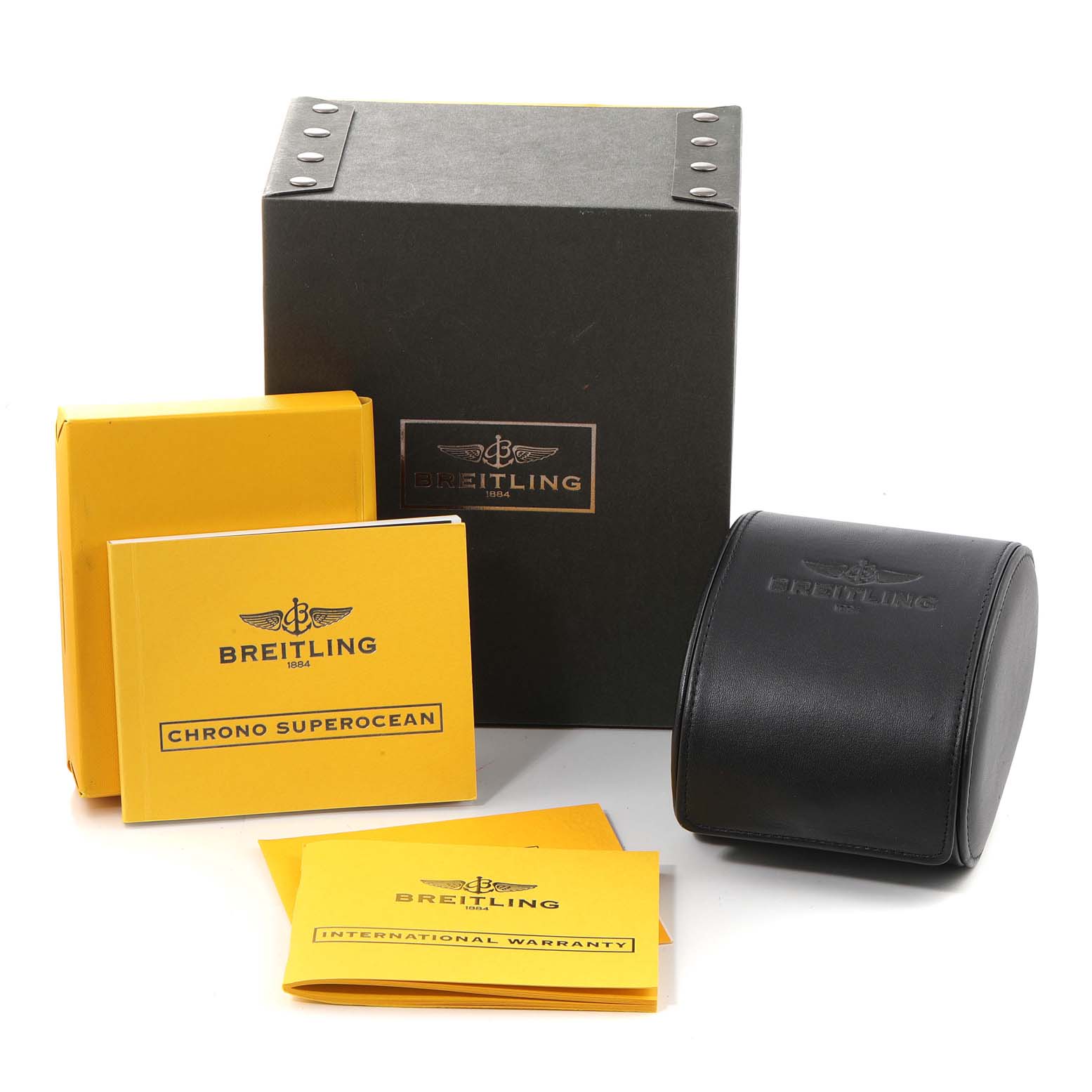 Breitling Superocean A13340 Men's Stainless Steel Beige Dial A13340 Men's Stainless Steel Beige Dial accessories include a branded box, case, manuals, and warranty cards arranged at an angled view.