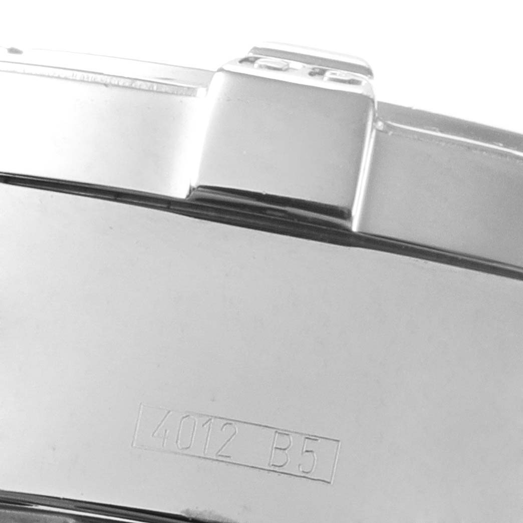 The image shows a close-up angle of the side of a Breitling Superocean A13340 Men's Stainless Steel Beige Dial A13340 Men's Stainless Steel Beige Dial watch case, including part of the bezel and serial number.