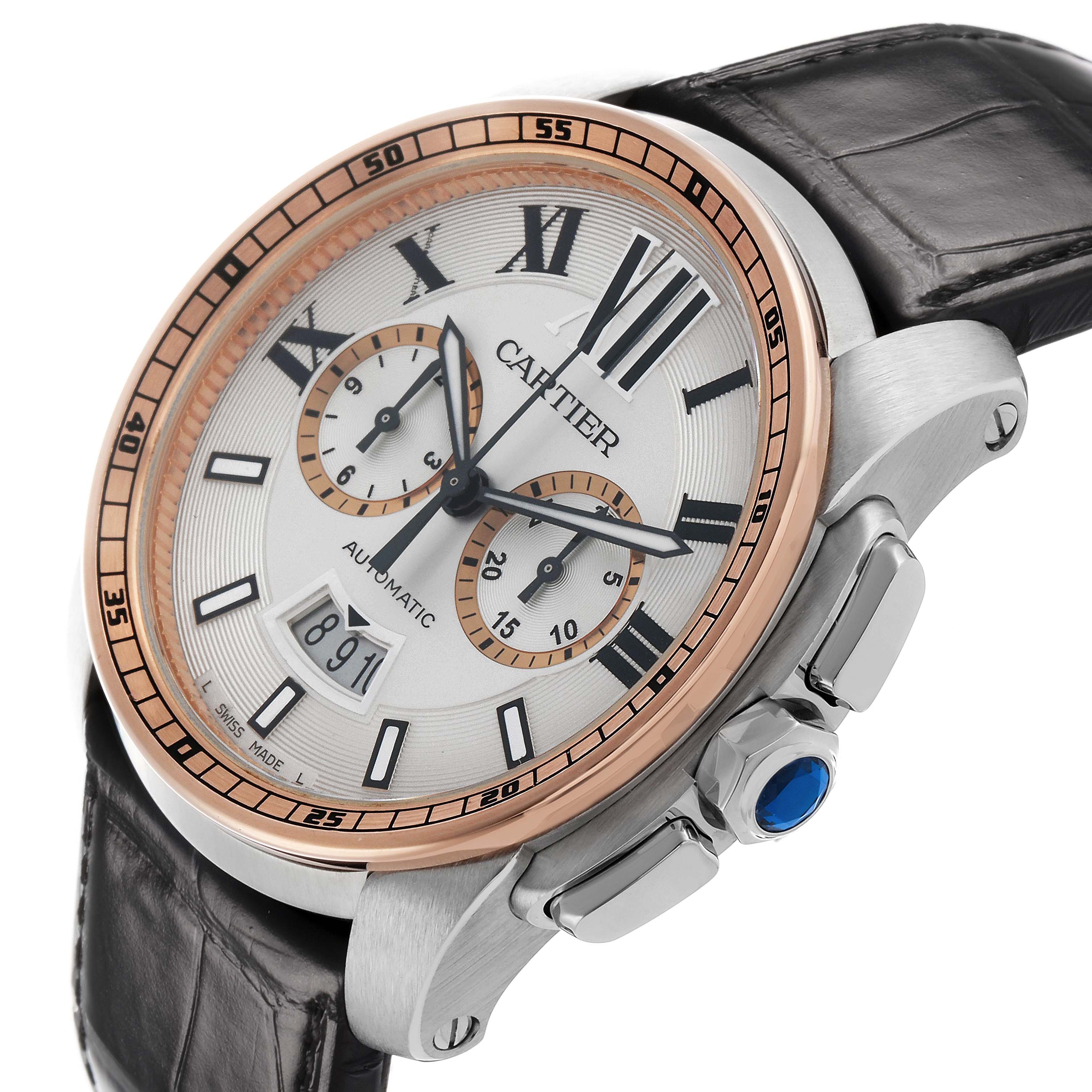 The Calibre de Cartier watch is shown at a 3/4 angle displaying its face, bezel, crown with blue detailing, and strap.